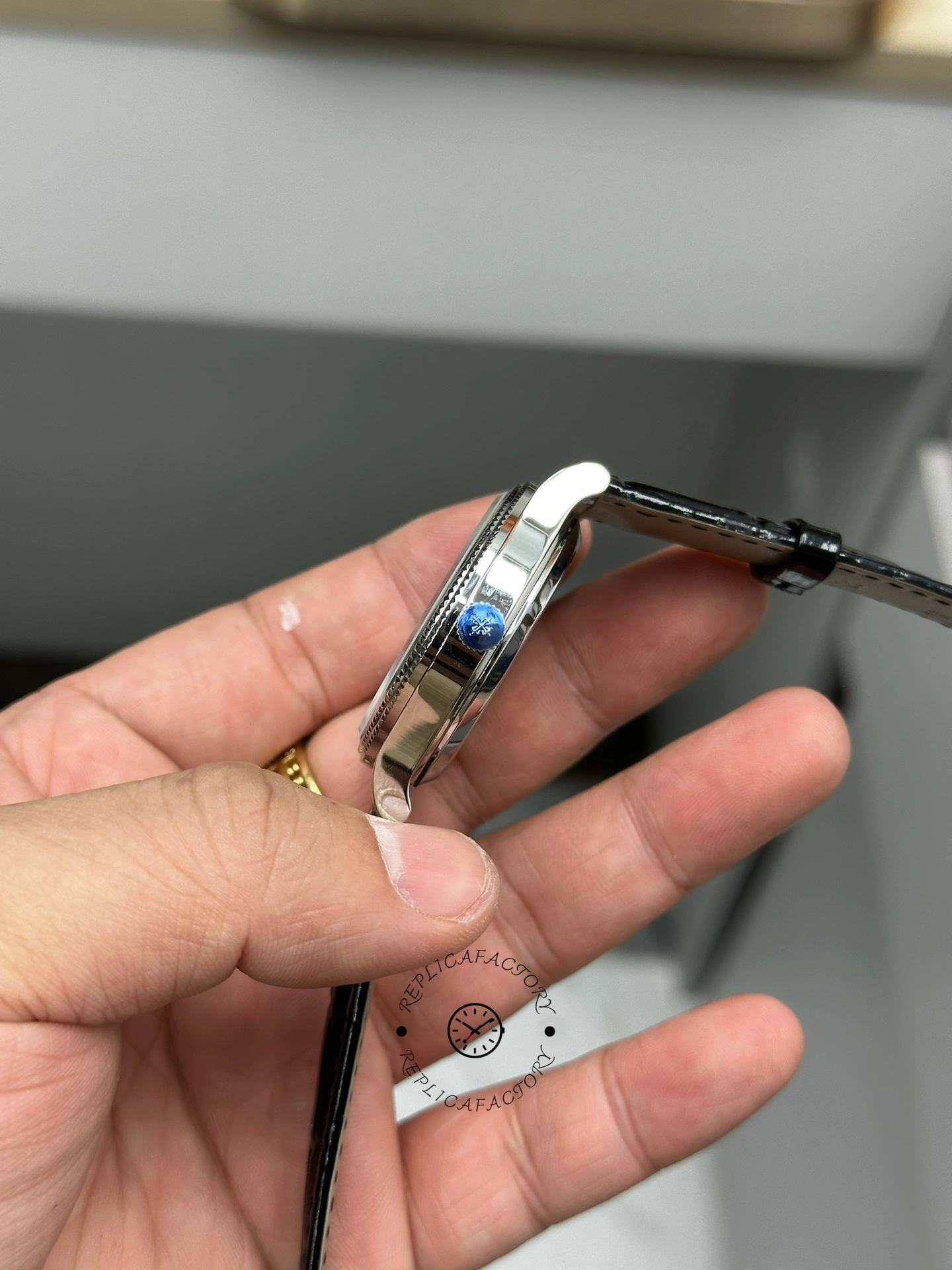 Crown angle of Patek Philippe Calatrava 6119G-001 showing slim case profile and crown.