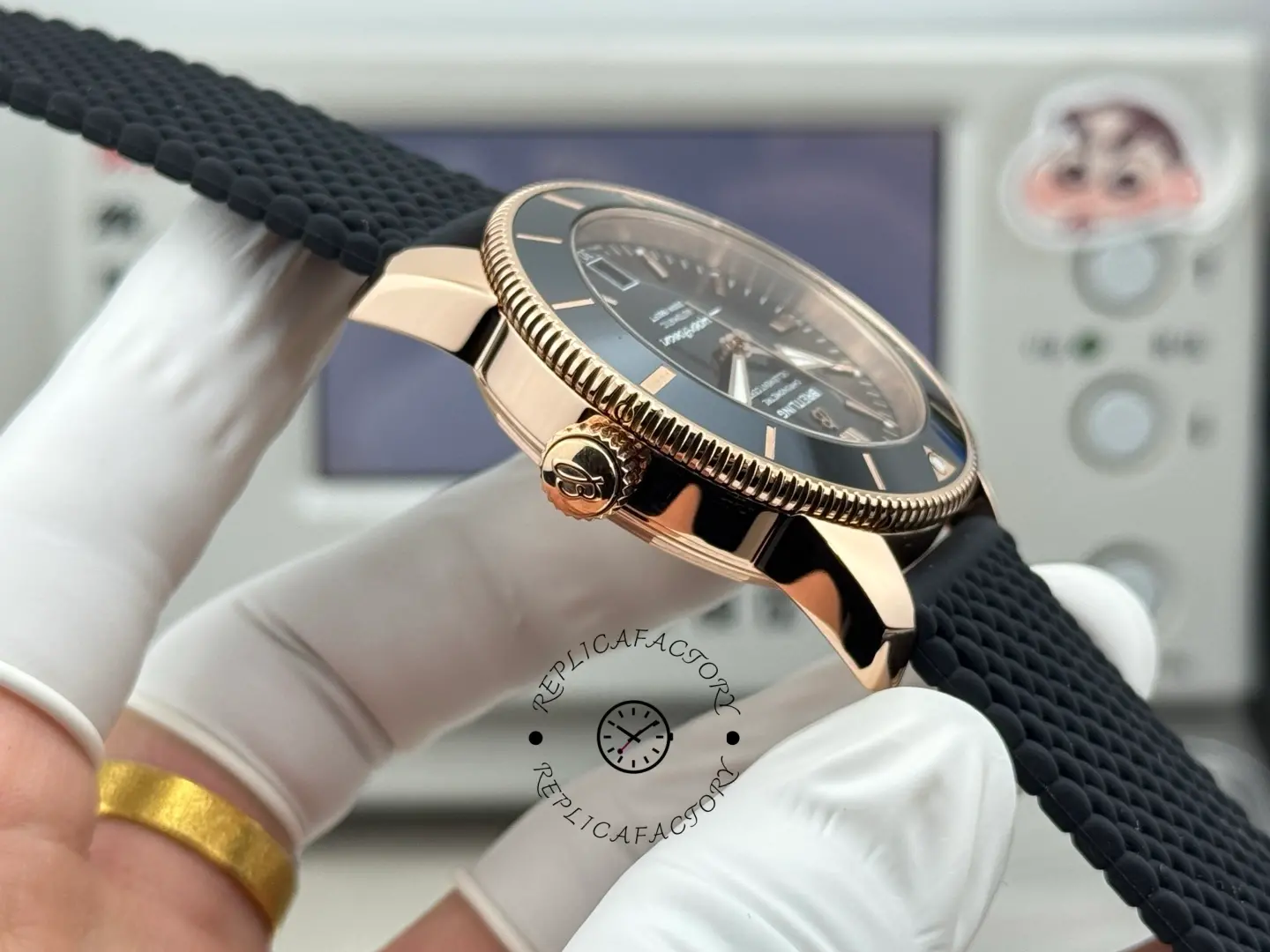 Breitling RB2010121B1S1, side profile showing crown and case curvature with black strap attached.