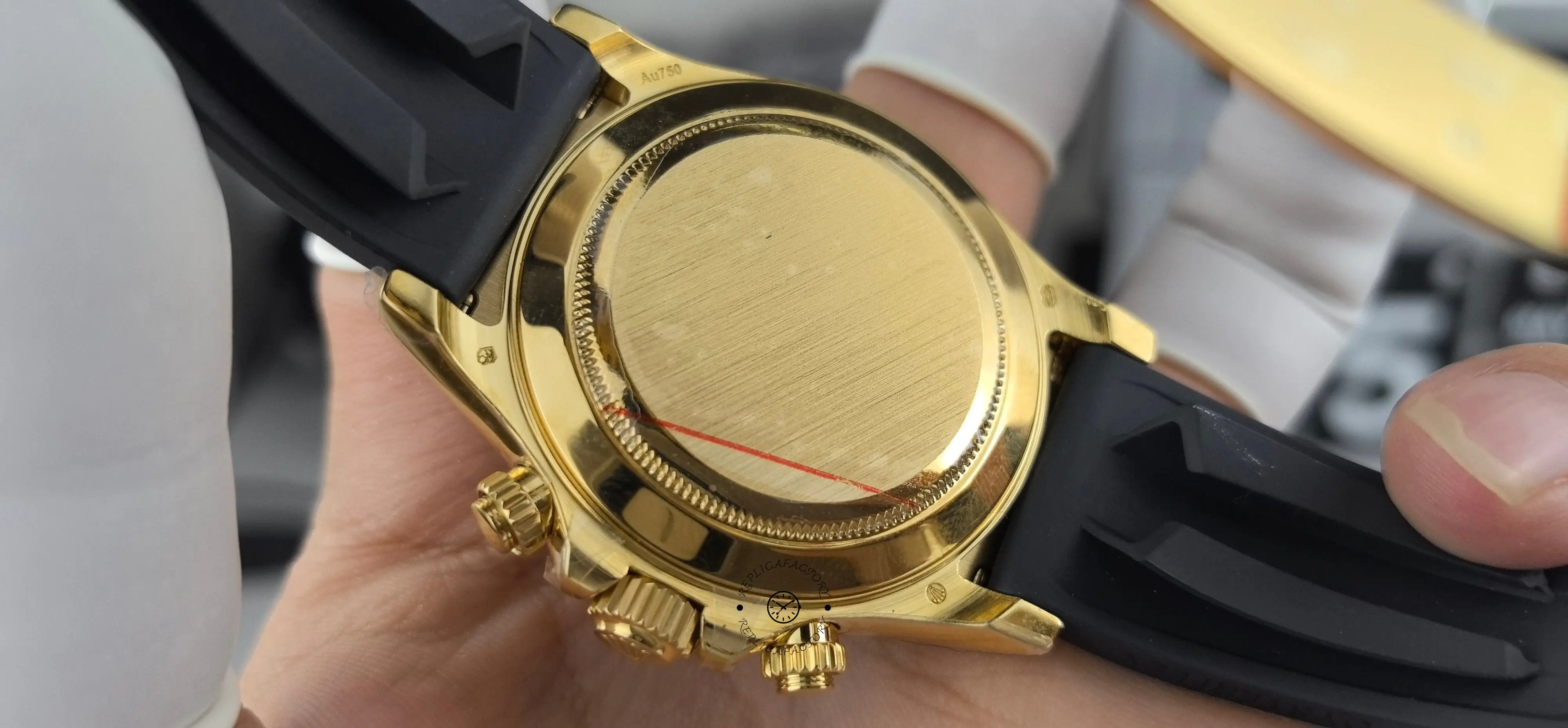 Case back view of Rolex Daytona 116518LN with closed gold-tone back and black Oysterflex strap.