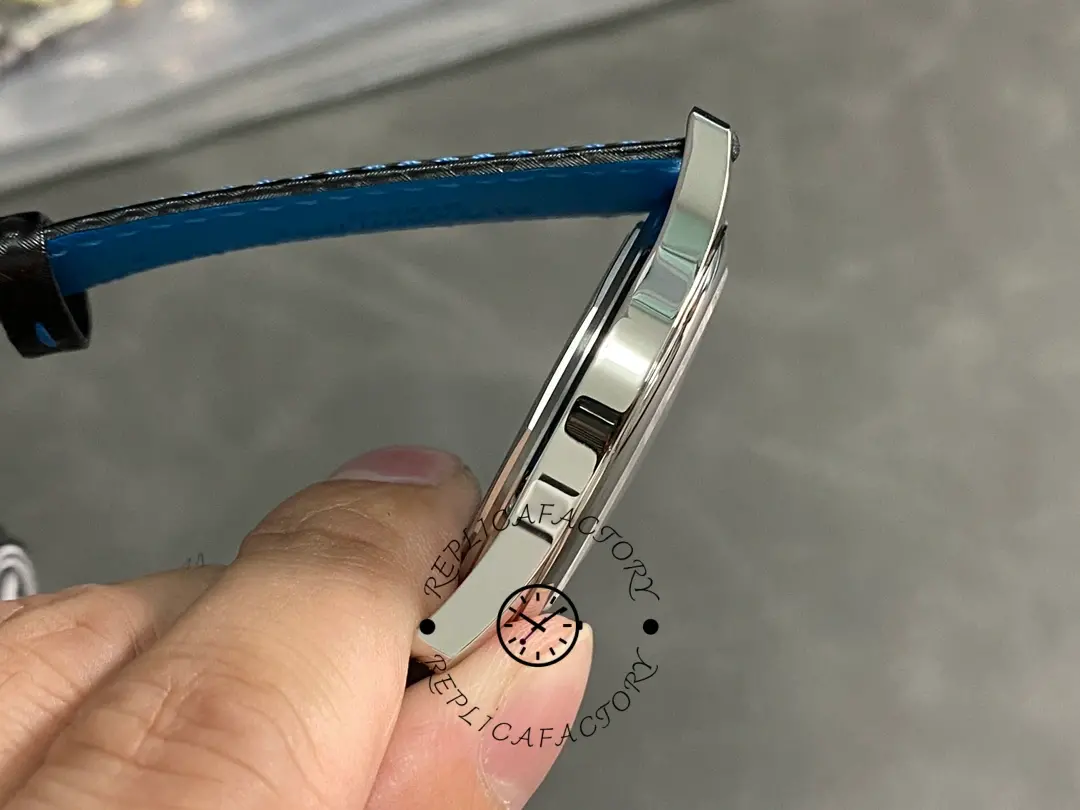 Side profile of the Patek Philippe Calatrava 6007G-011 with blue strap, showing slim case and lugs.