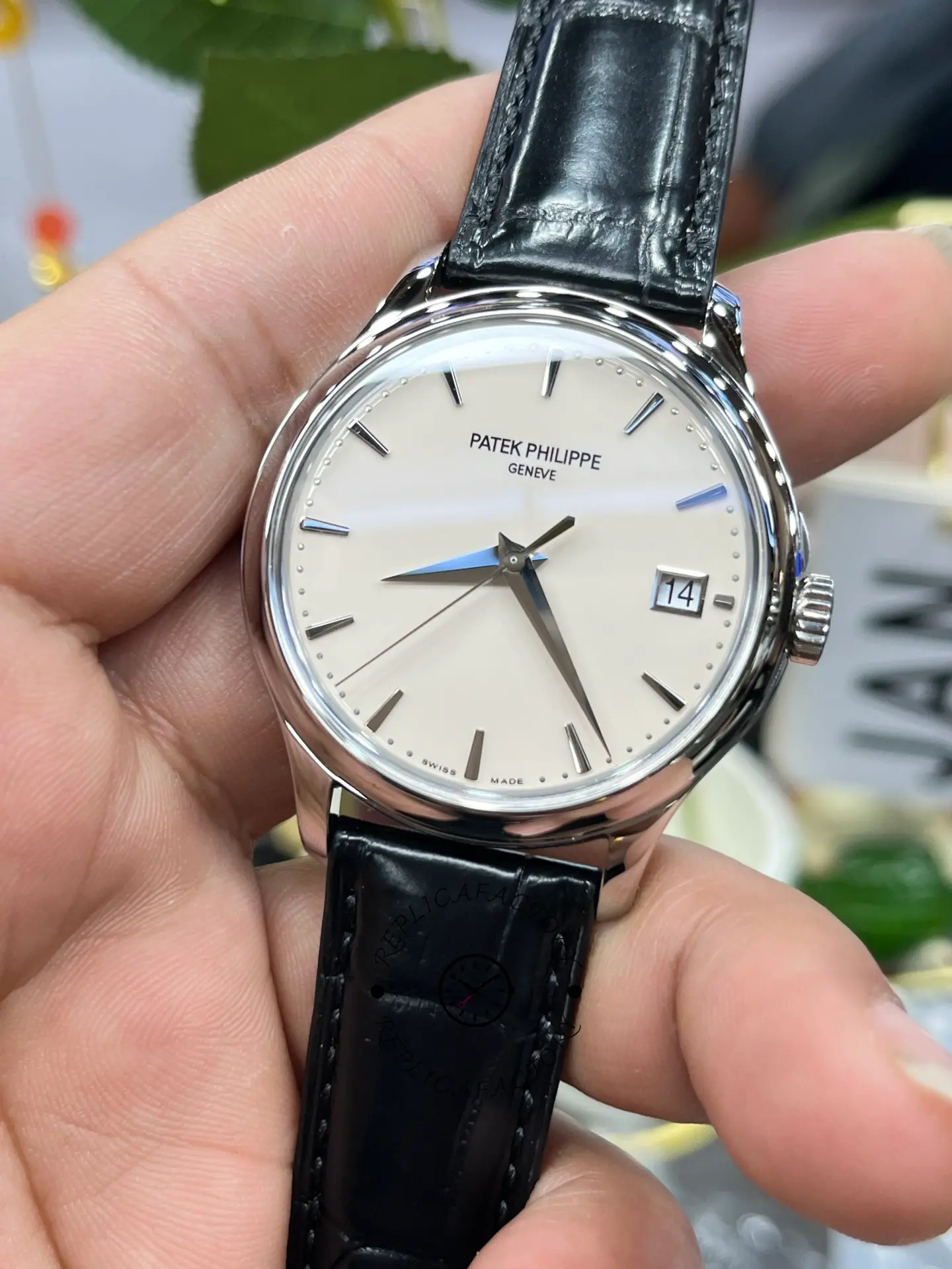 Close front shot of the Patek Philippe Calatrava 5227G-001 highlighting the hands and applied hour markers.