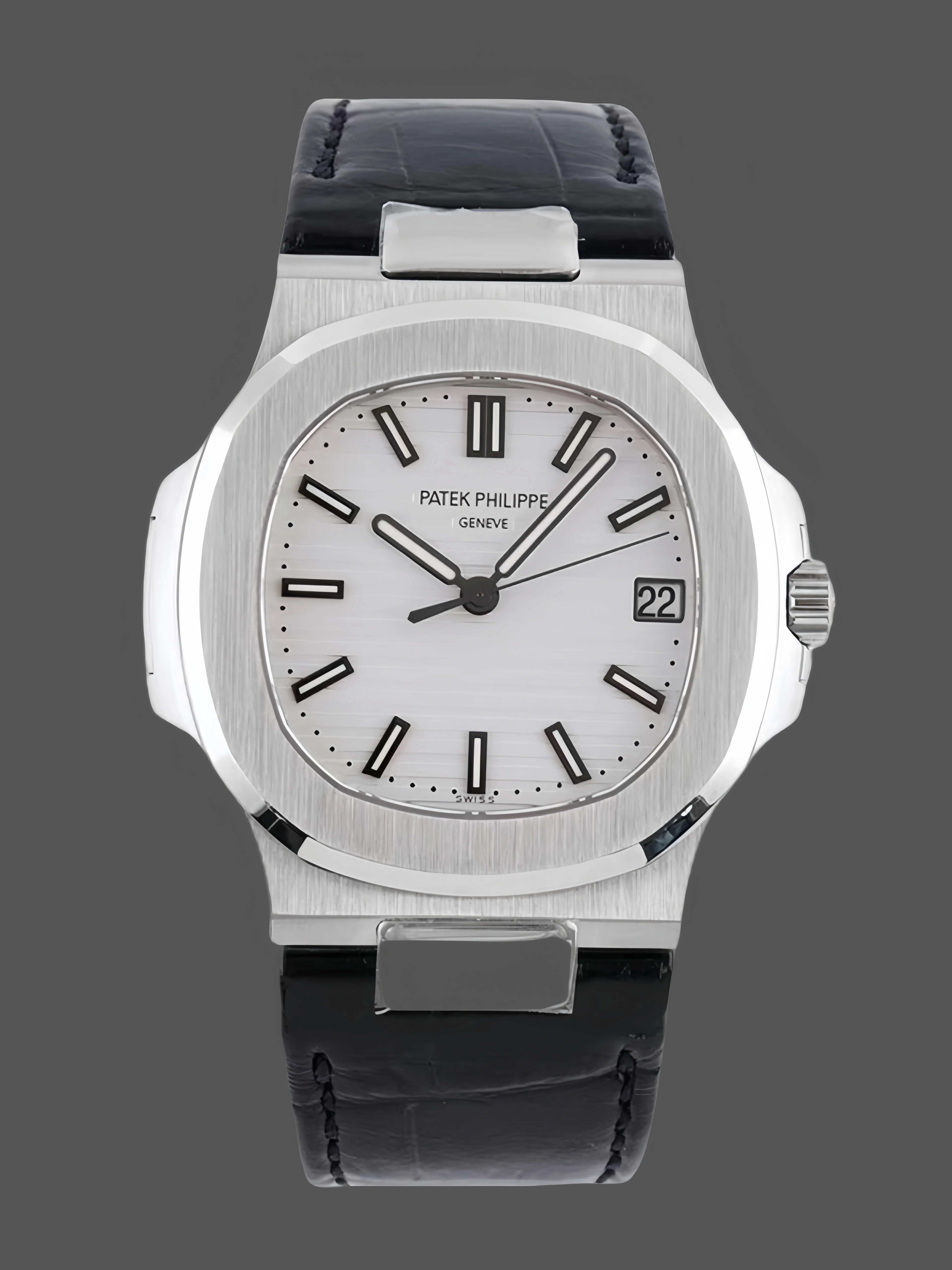 Front view of the Patek Philippe Nautilus 5711/1A, white dial, baton markers, and date window. - Front view