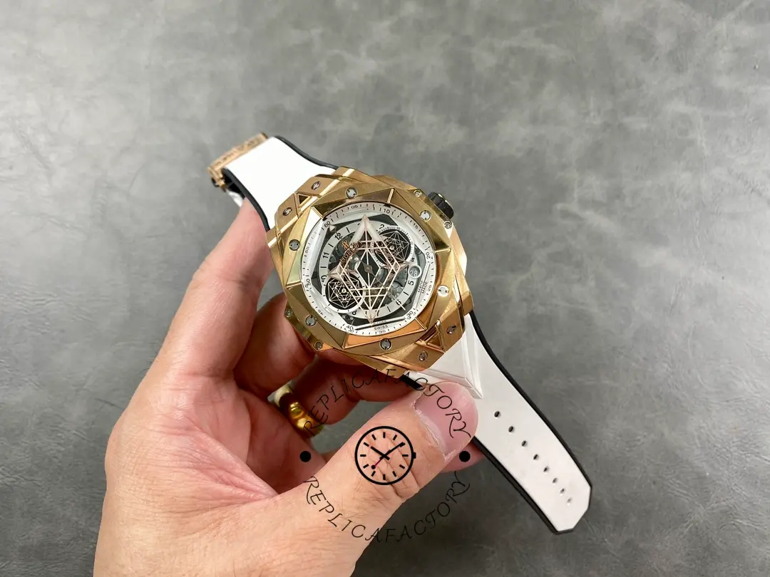 A complete handheld watch of Hublot 418.OX.2001.RX.MXM20, showcasing the dial, bezel screws, and strap.