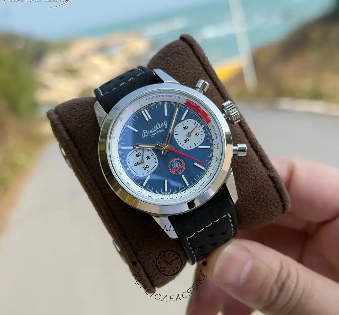Breitling Top Time B01 Shelby Cobra AB01763A1C1X1, cushion shot showing blue dial and strap texture.