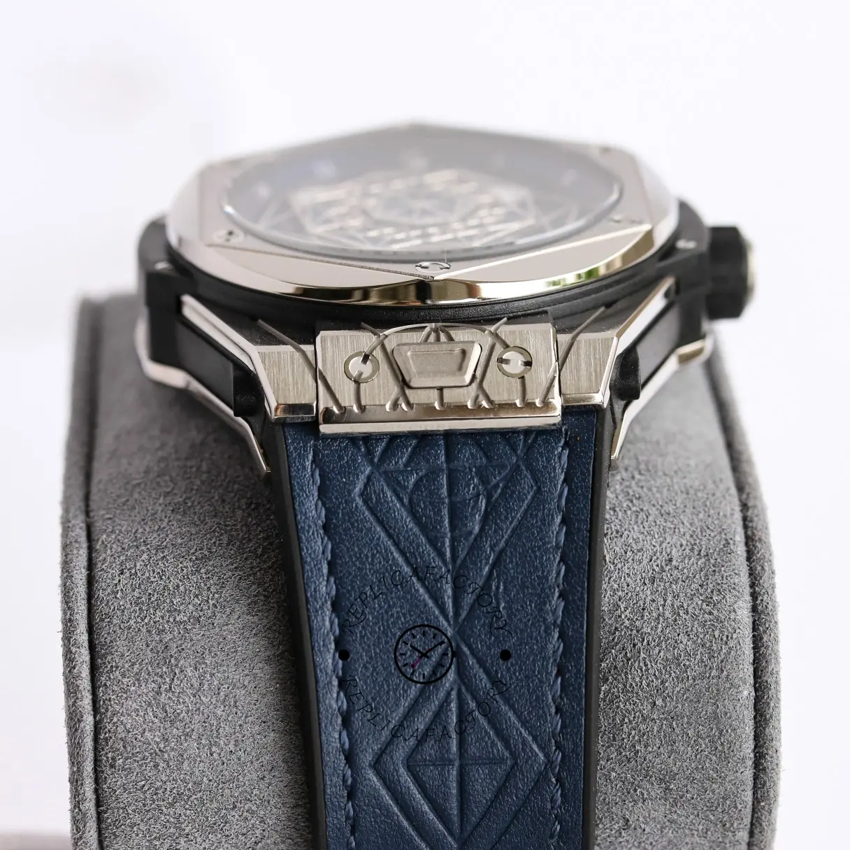 Side view of Hublot Big Bang 415.NX.1112.VR.MXM16 on cushion, showing case side and strap fit.