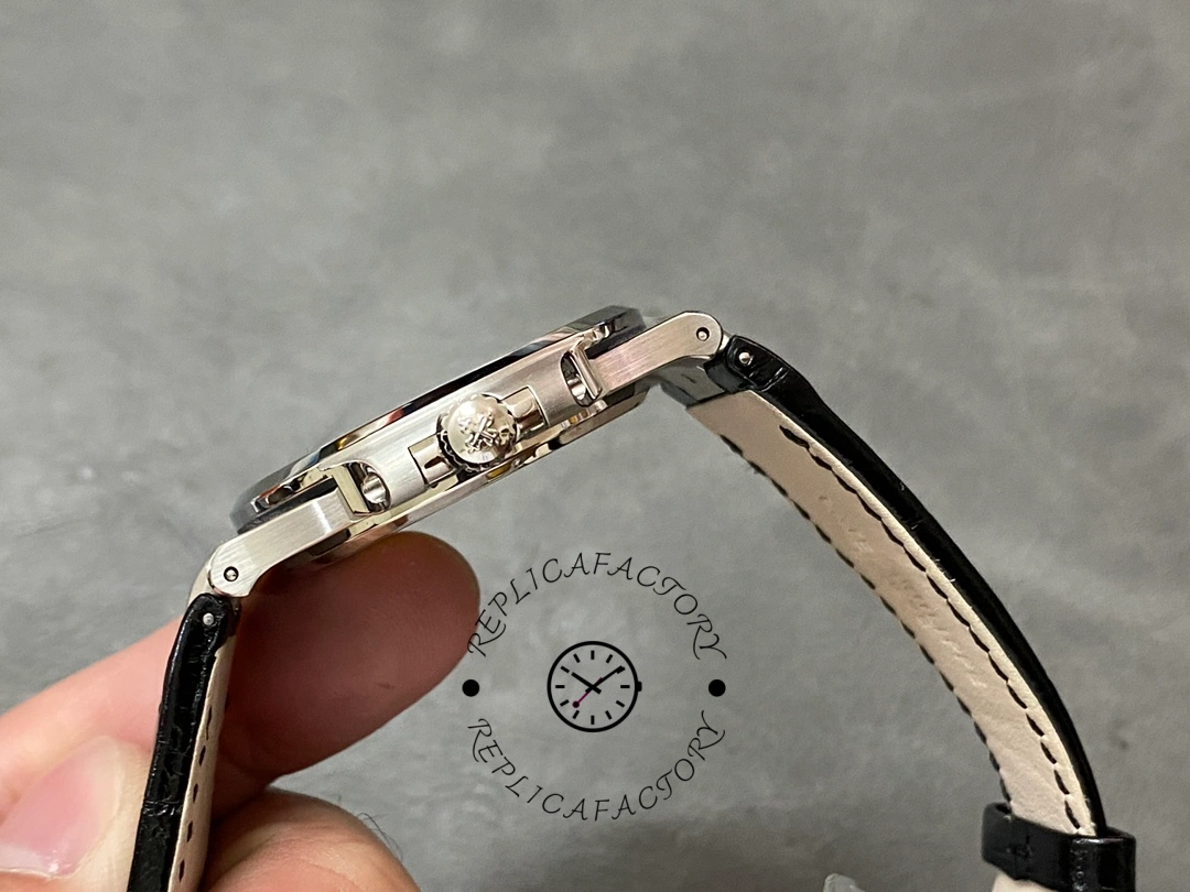 Side profile of the Patek Philippe Nautilus 5711/1A, showing crown and strap attachment.