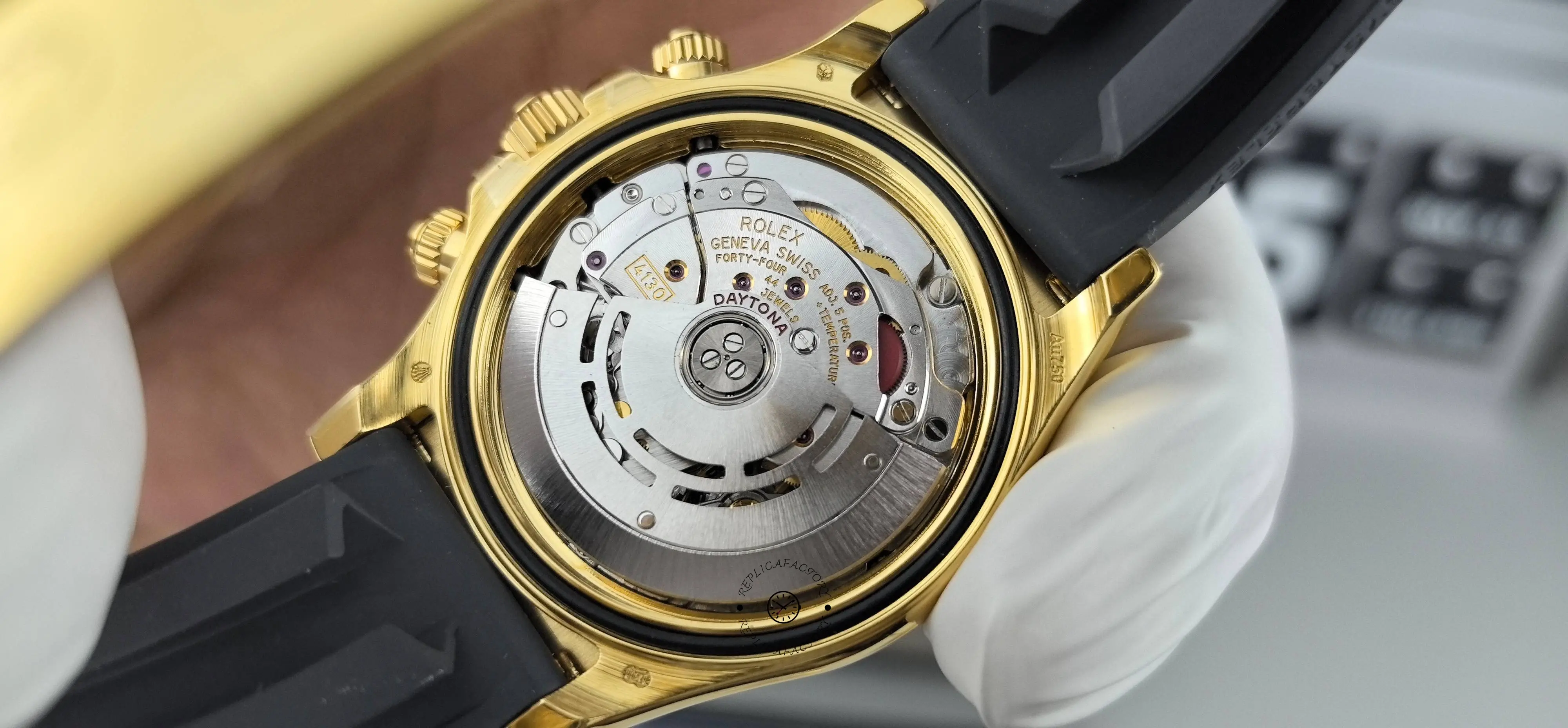 Close movement view of Rolex Daytona 116518LN showing rotor and inner movement details.