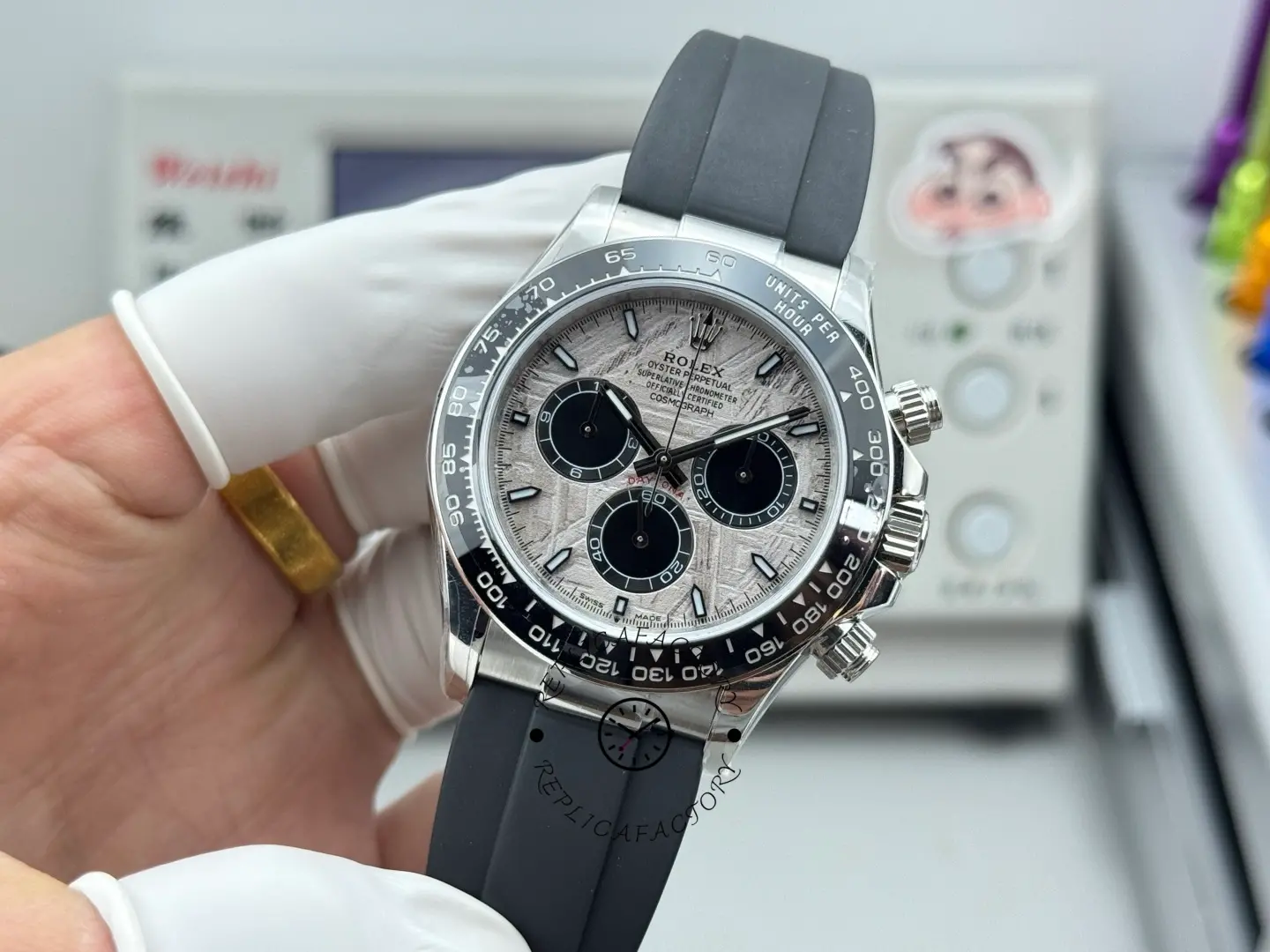 Handheld angled front view of Rolex Daytona 116519 with meteorite dial and black ceramic bezel.