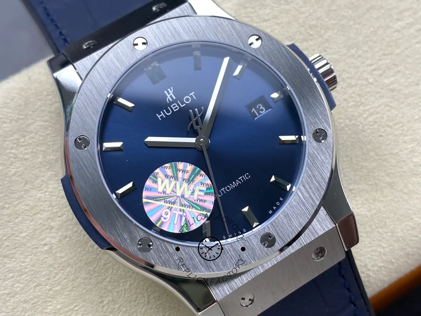 Close-up dial of Hublot Classic Fusion 542.NX.7170.LR showing sunburst blue face and baton markers.