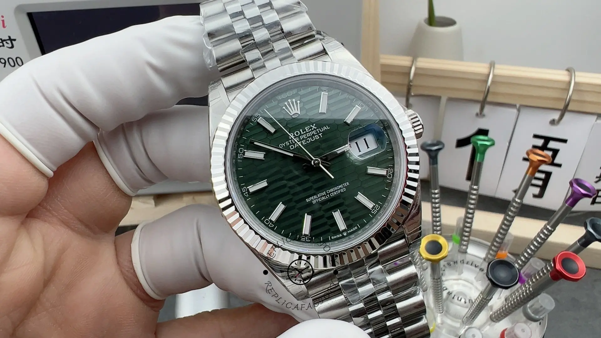 Front view of Rolex Datejust 41 126334-0030 with mint green dial, fluted bezel and Jubilee bracelet.