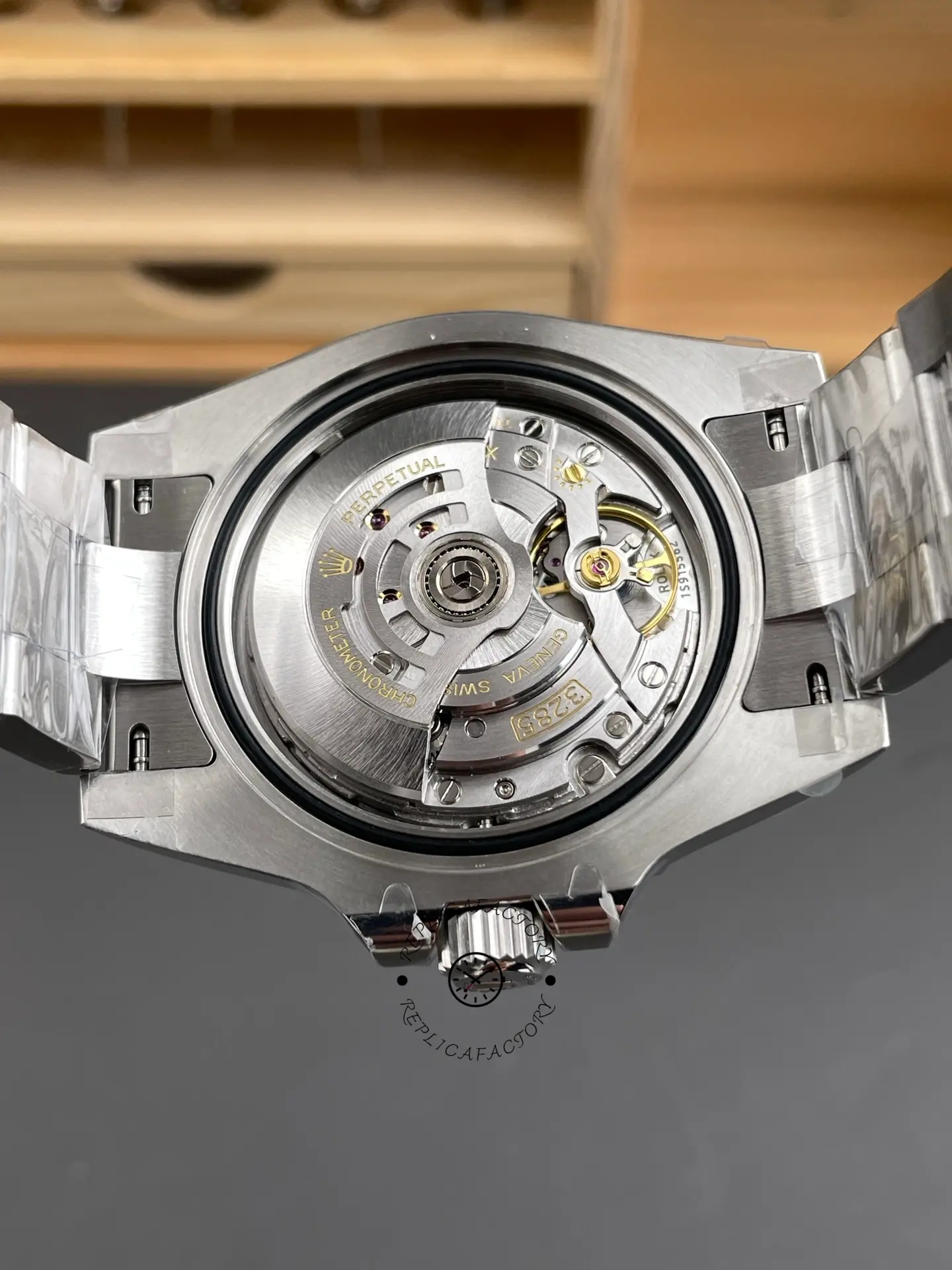 Open caseback view of Rolex GMT-Master II 116710BLNR showing automatic movement and rotor.