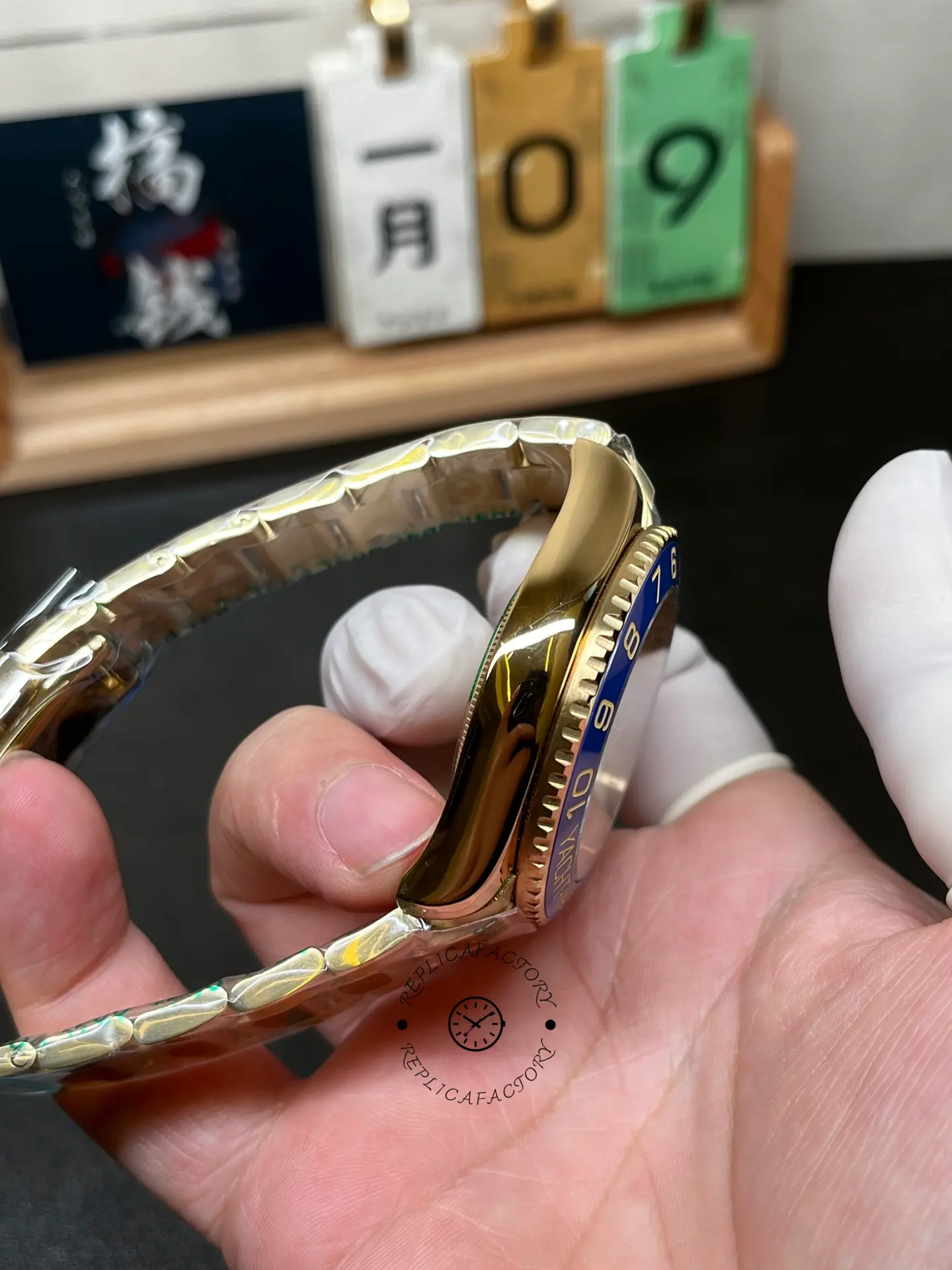 Left side case view of Rolex Yacht-Master II 116688 showing gold-tone case and bezel edge.