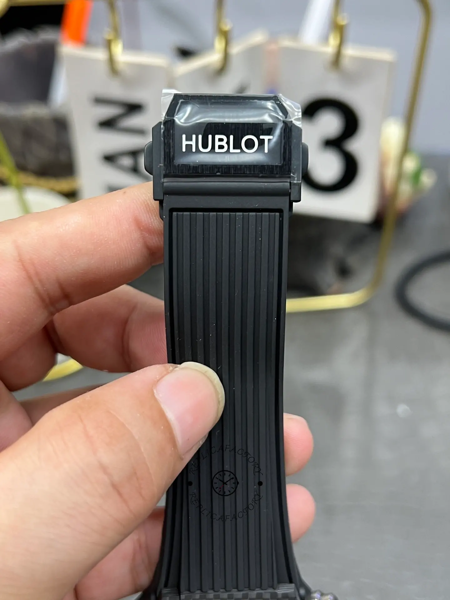 Hublot Big Bang UNICO 411.QX.1170.RX clasp and strap end view, rubber strap hardware detail.