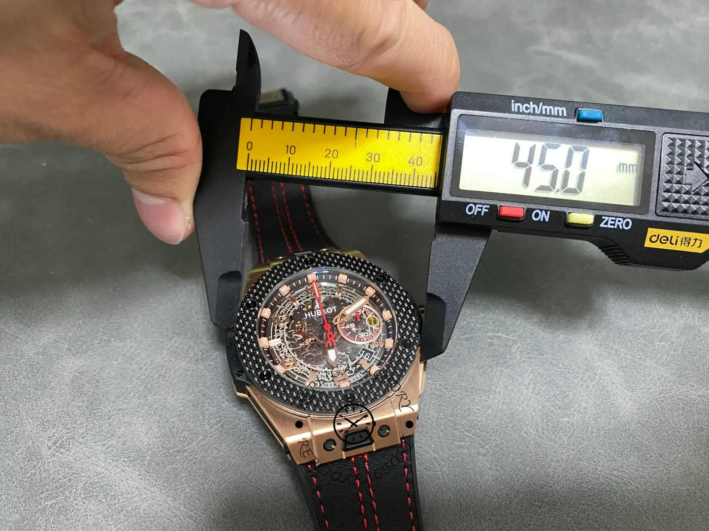 Caliper measurement of Hublot Big Bang Unico Ferrari 401.OX.0123.VR showing case diameter reading.