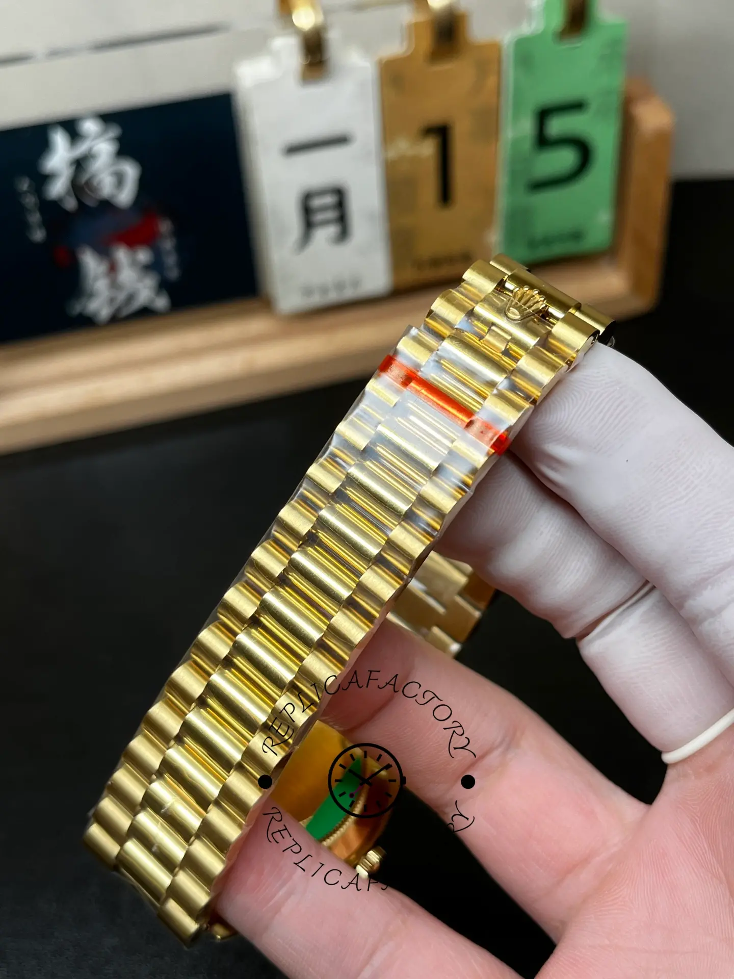 Bracelet close-up of Rolex 228238-0061 showing yellow gold style President links.