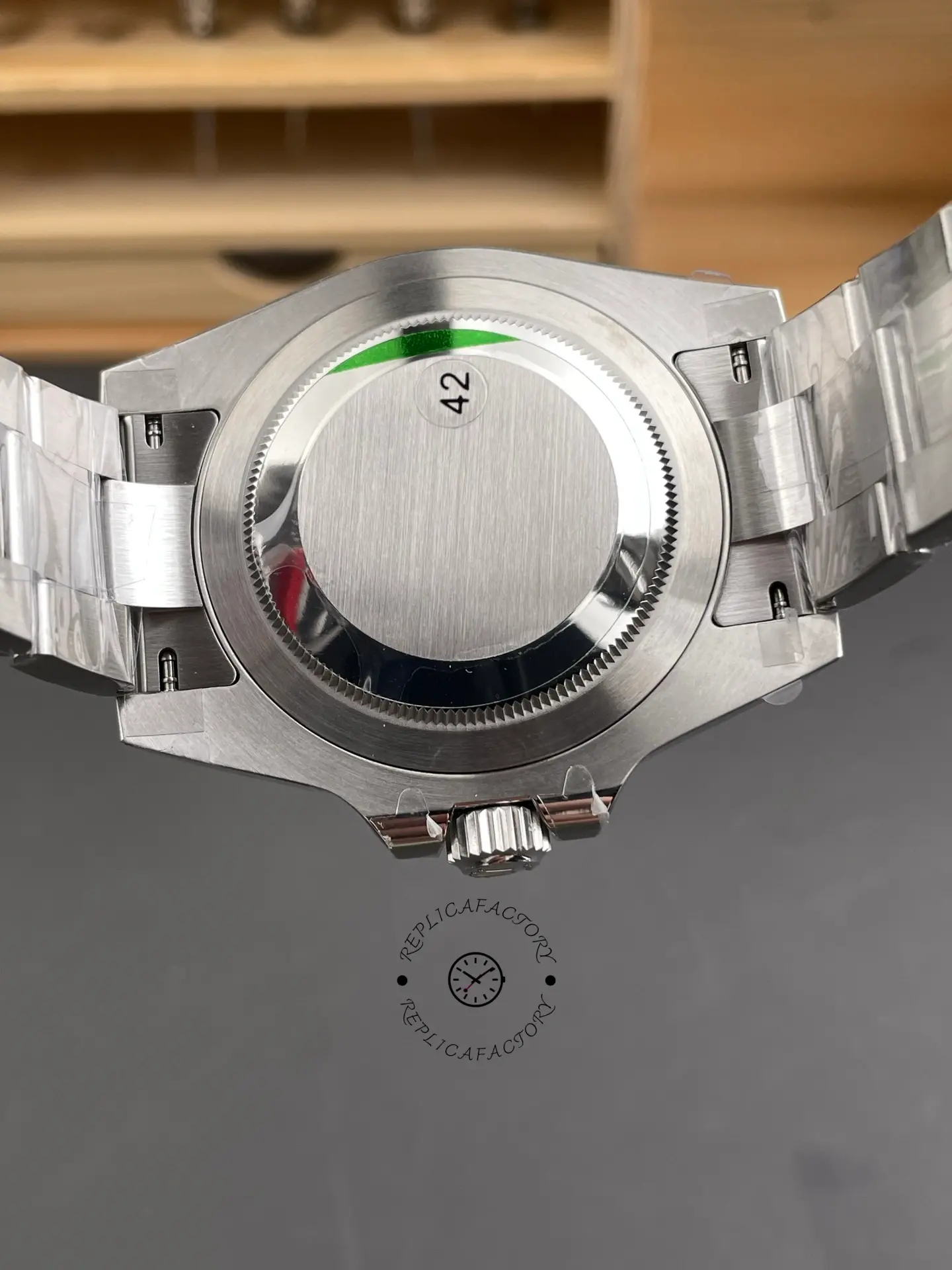 Solid caseback view of Rolex GMT-Master II 116710BLNR showing brushed back and Oyster bracelet links.