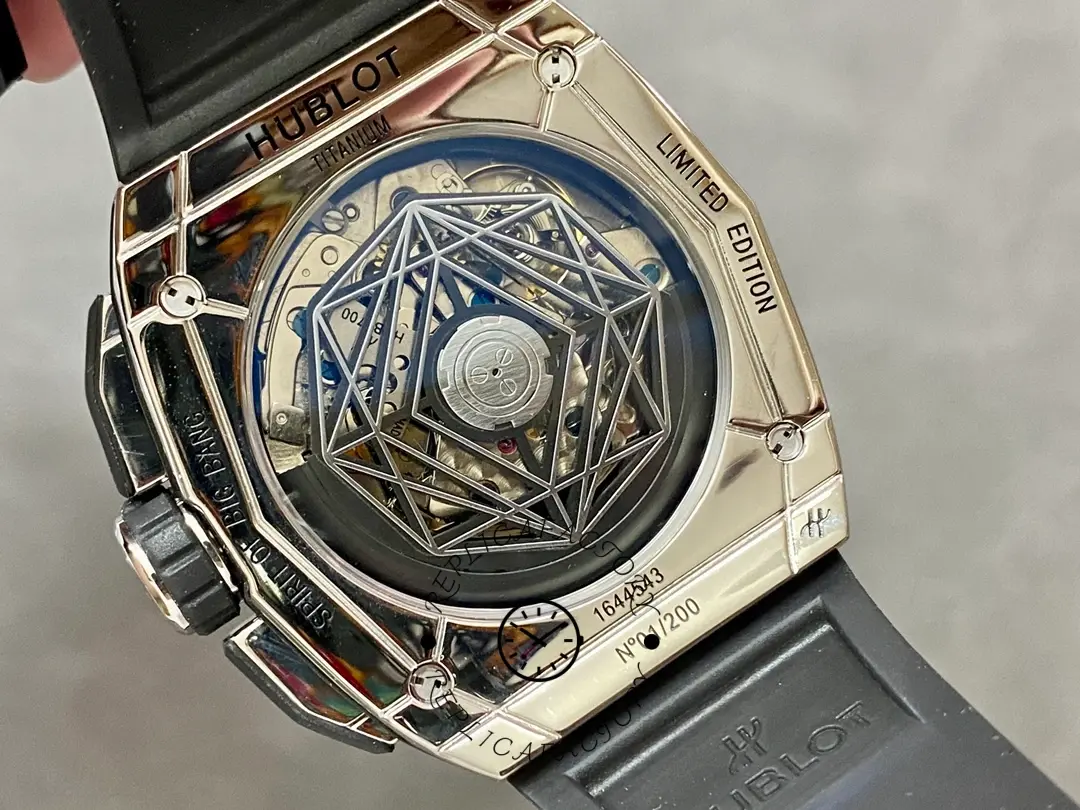 Caseback view of Hublot 648.NX.0107.RX.1604.MXM23 showing exhibition back, rotor, and engraved text ring.