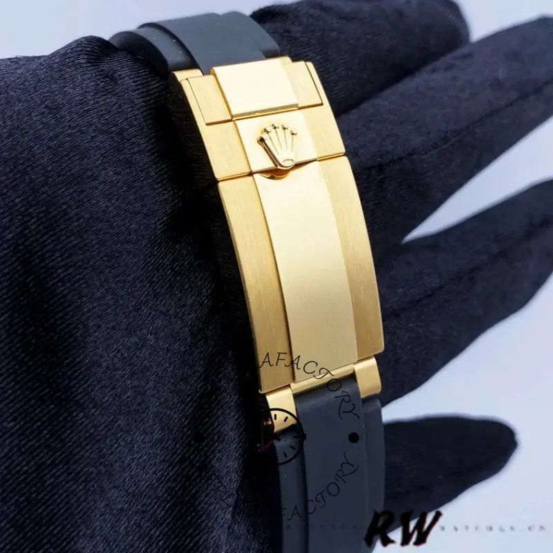 Back clasp view of Rolex Daytona 116518LN showing the yellow gold folding clasp on the black strap.