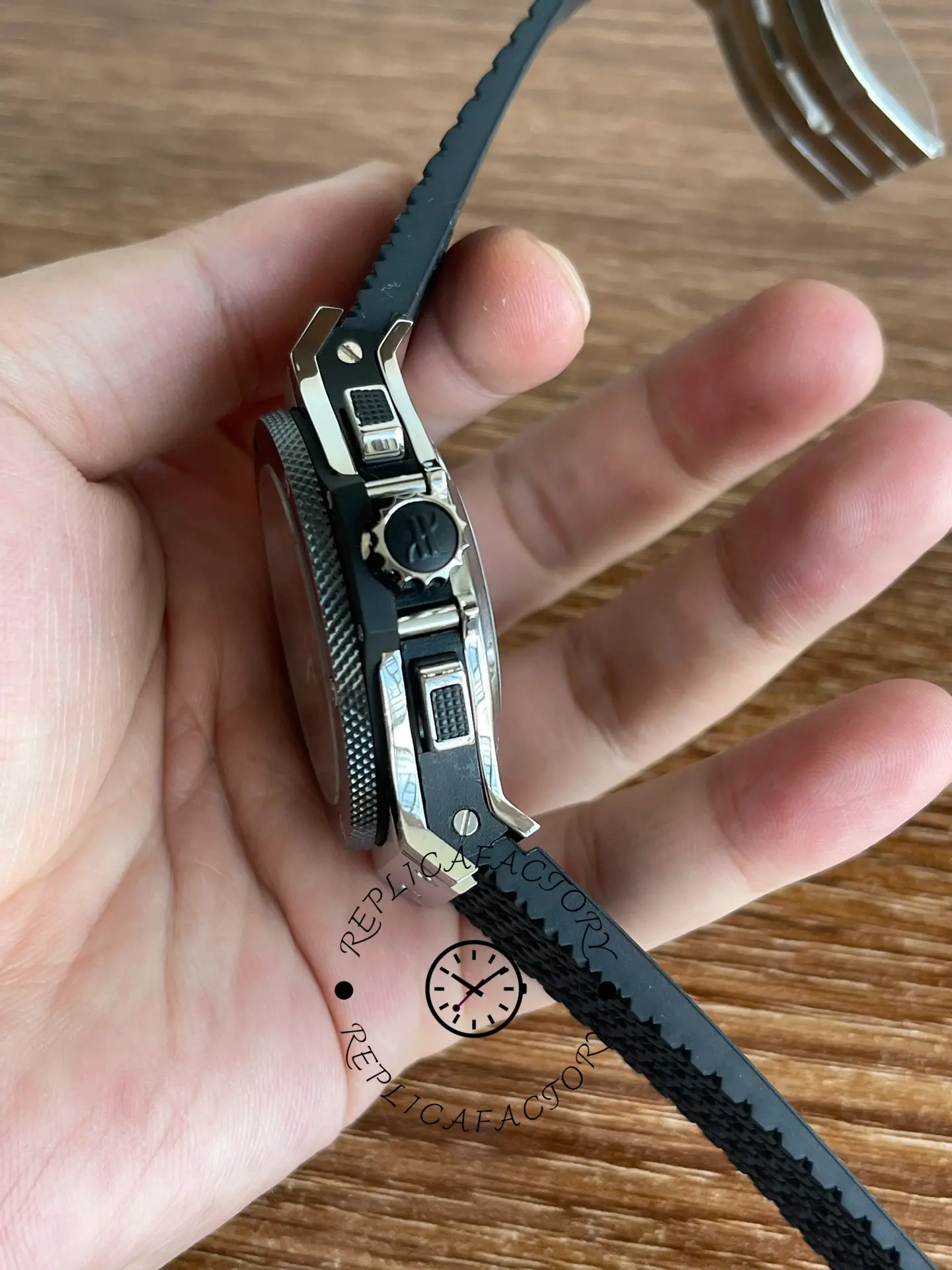 Crown-side close-up of Hublot Big Bang 301.SB.131.RX showing crown guard and pusher texture.