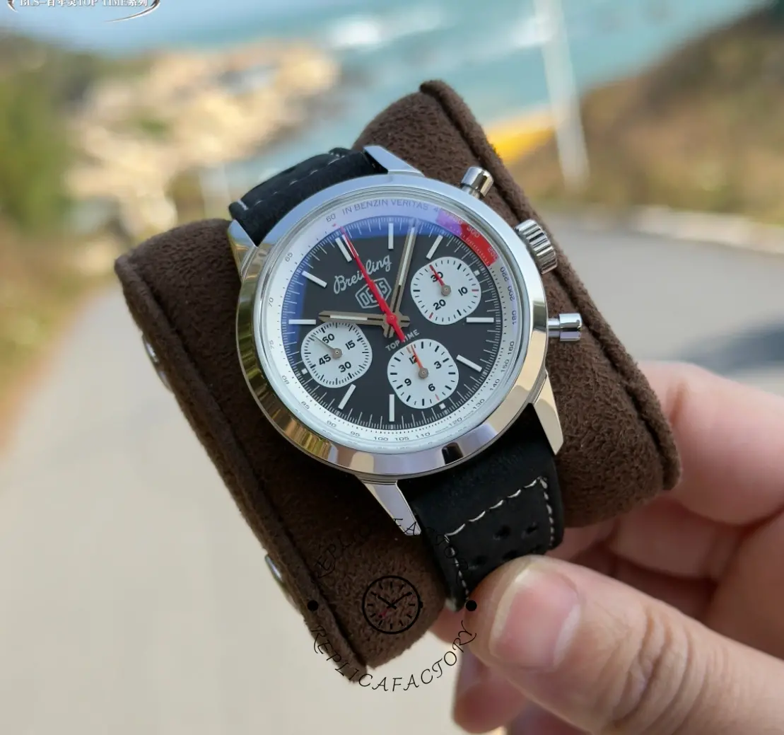 Breitling Top Time B01 Deus Chronograph AB01765A1B1X1, cushion shot showing black dial and black strap.