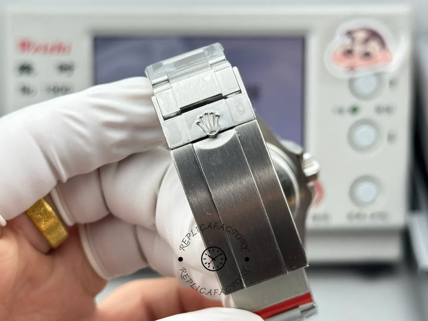 Bracelet clasp view of Rolex Sea-Dweller 126600 showing the clasp surface and crown logo detail.