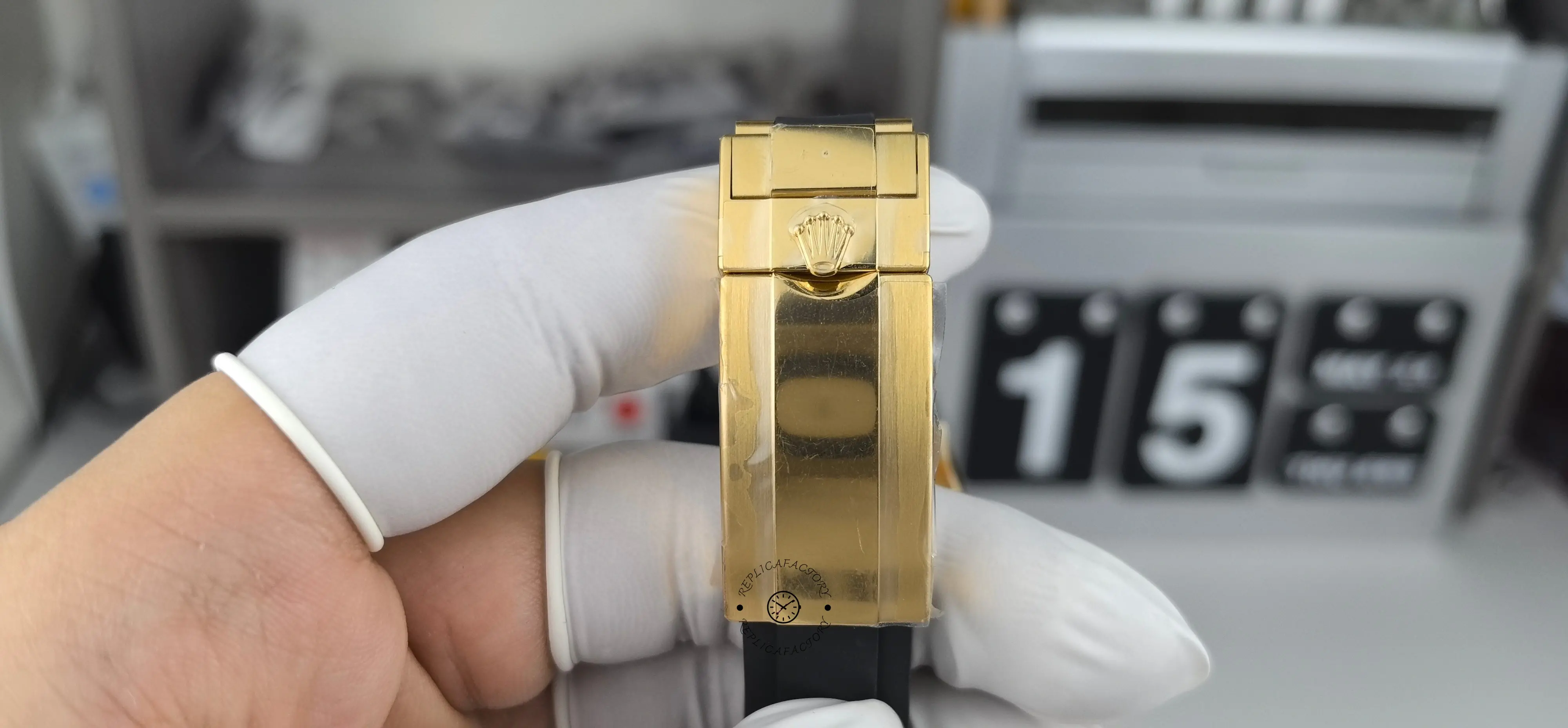 Clasp exterior view of Rolex Daytona 116518LN showing crown logo on gold-tone clasp.