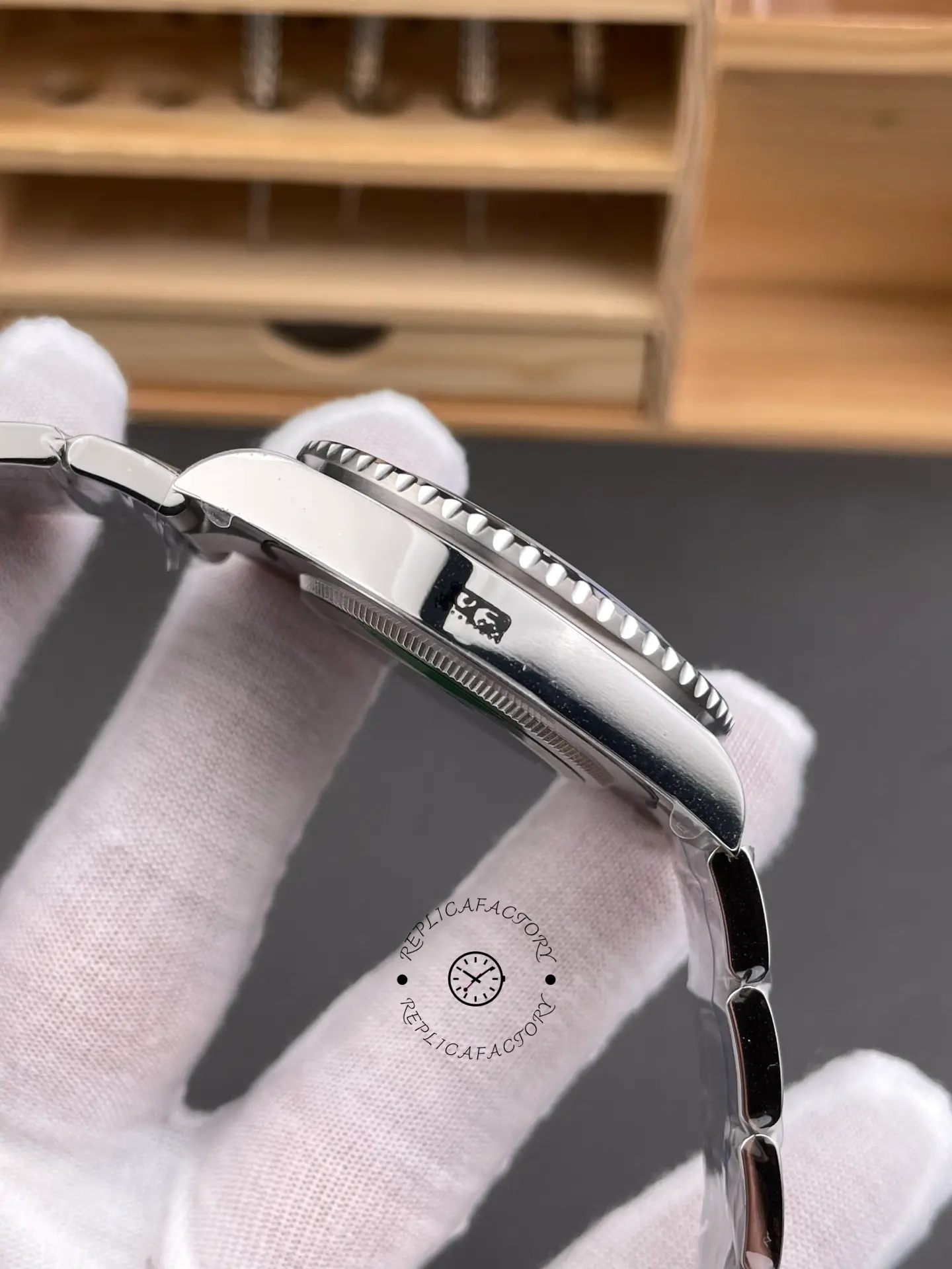 Opposite side profile of Rolex GMT-Master II 116710BLNR showing polished case side and bezel teeth.