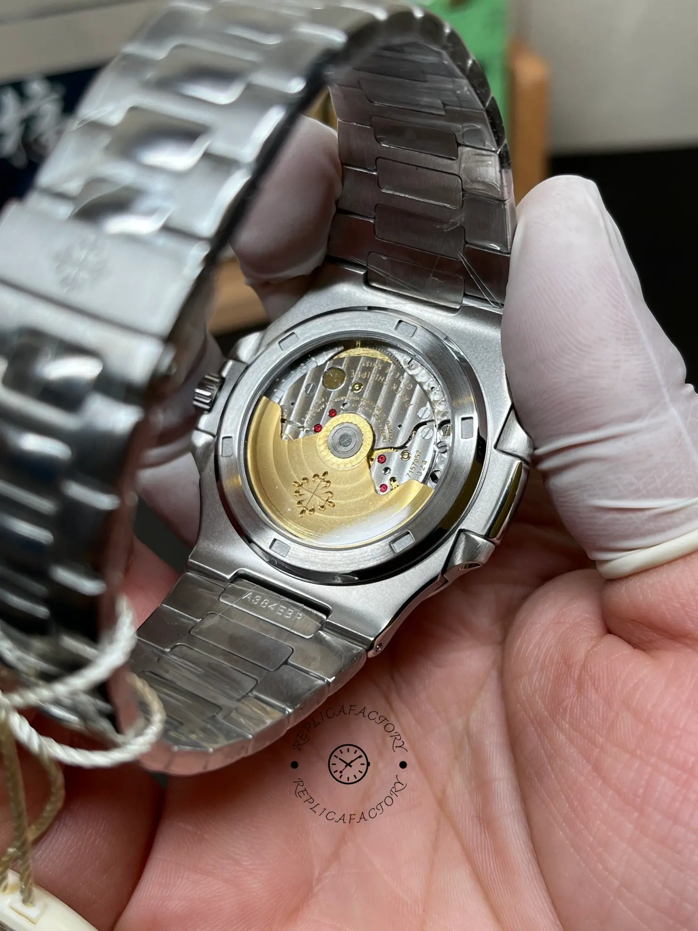 Exhibition caseback of Patek Philippe Nautilus 5711/1A showing gold rotor through sapphire back.