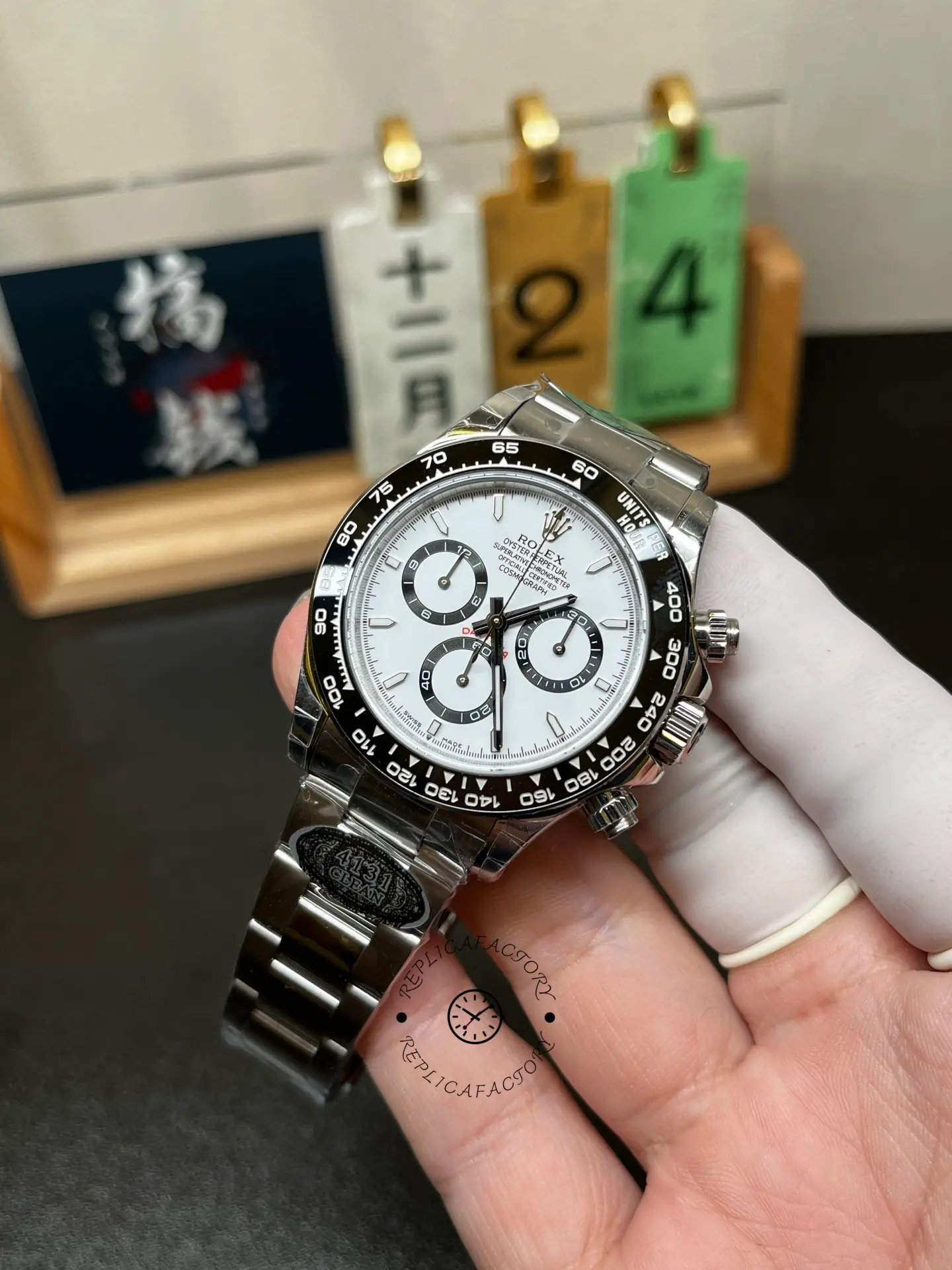Front angled view of Rolex Cosmograph Daytona M126500LN-0001 with white dial, black bezel and chronograph sub-dials.