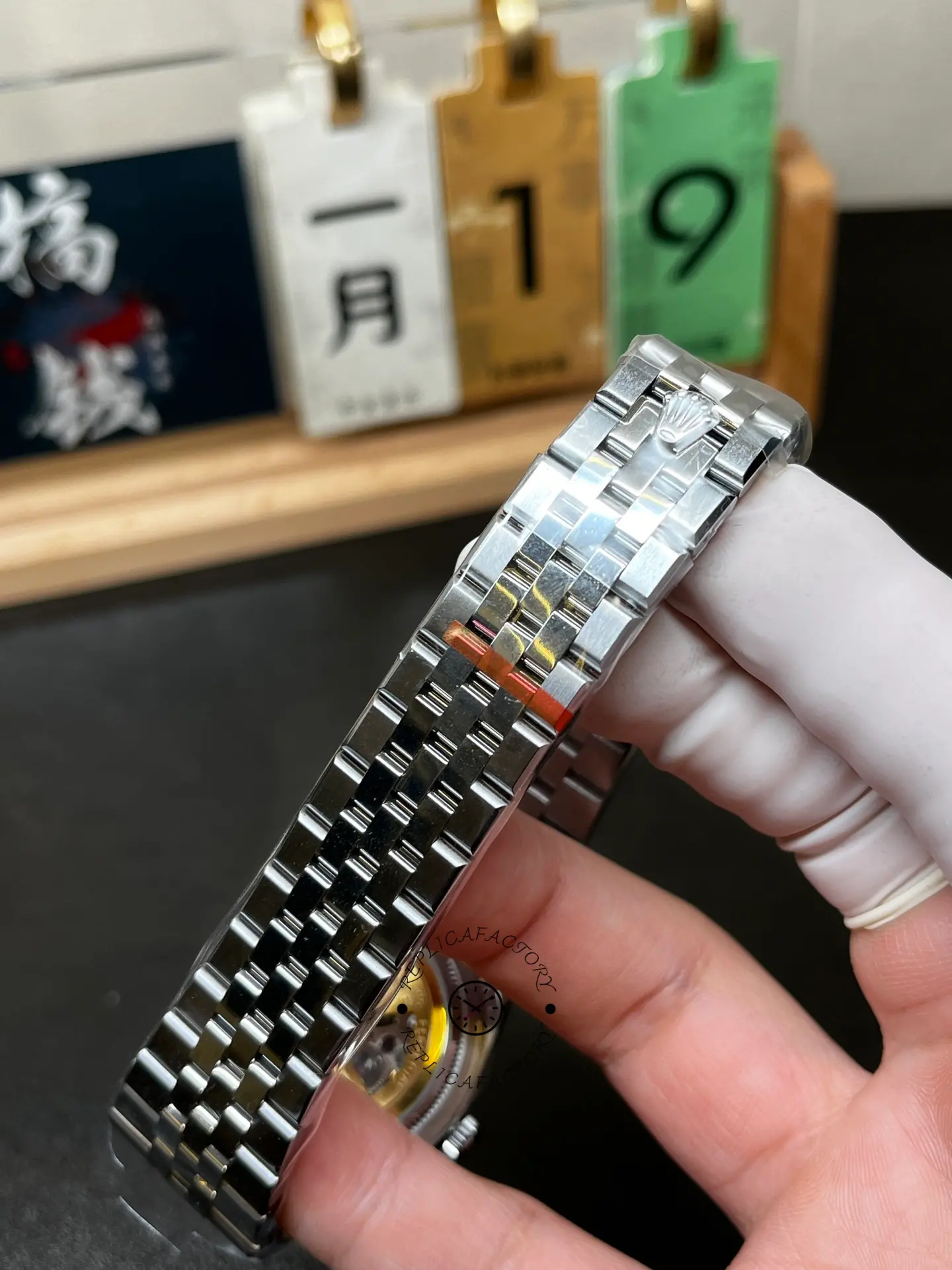 Bracelet detail of Rolex Land-Dweller 40 127336-0001 showing the integrated flat Jubilee-style bracelet and clasp.