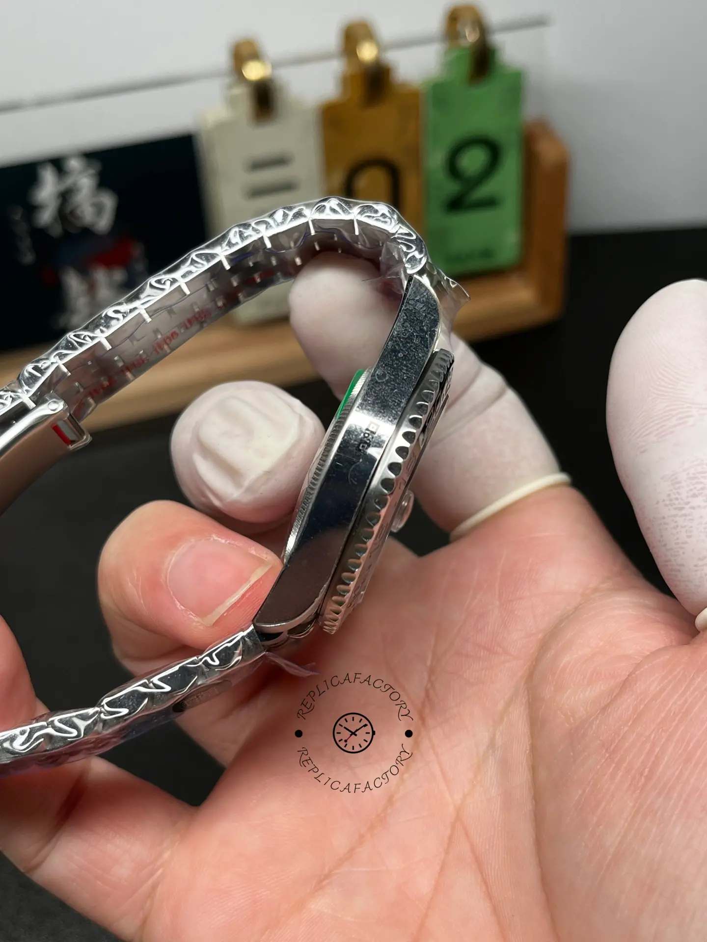 Side view of Rolex GMT-Master II M126710GRNR-0003 highlighting case thickness and Jubilee bracelet links.