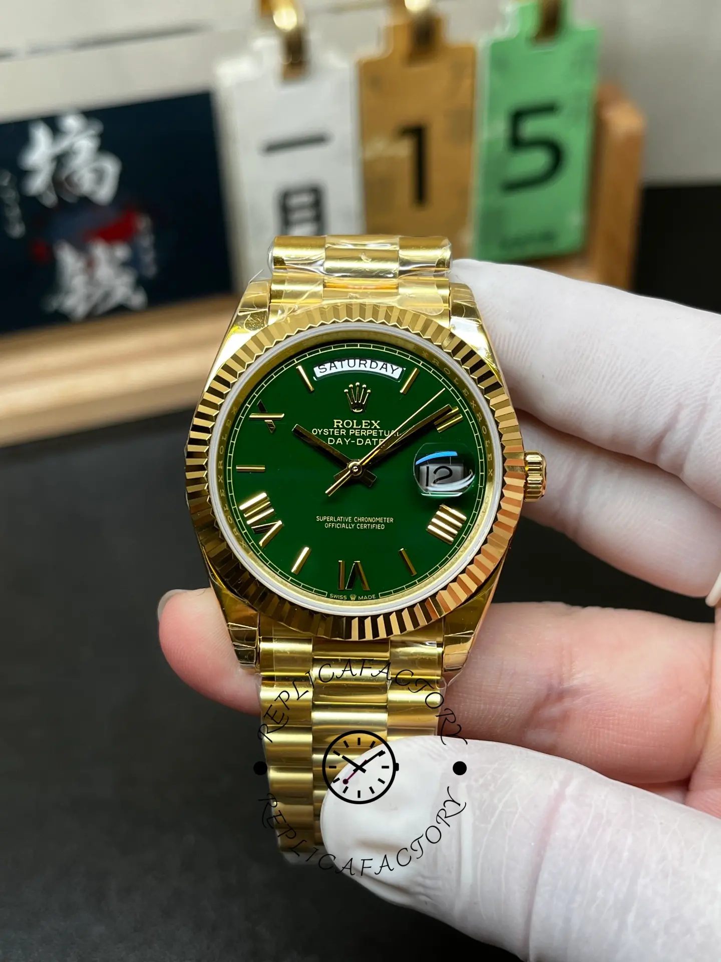 Front view of Rolex 228238-0061 showing green dial, date magnifier and fluted bezel.