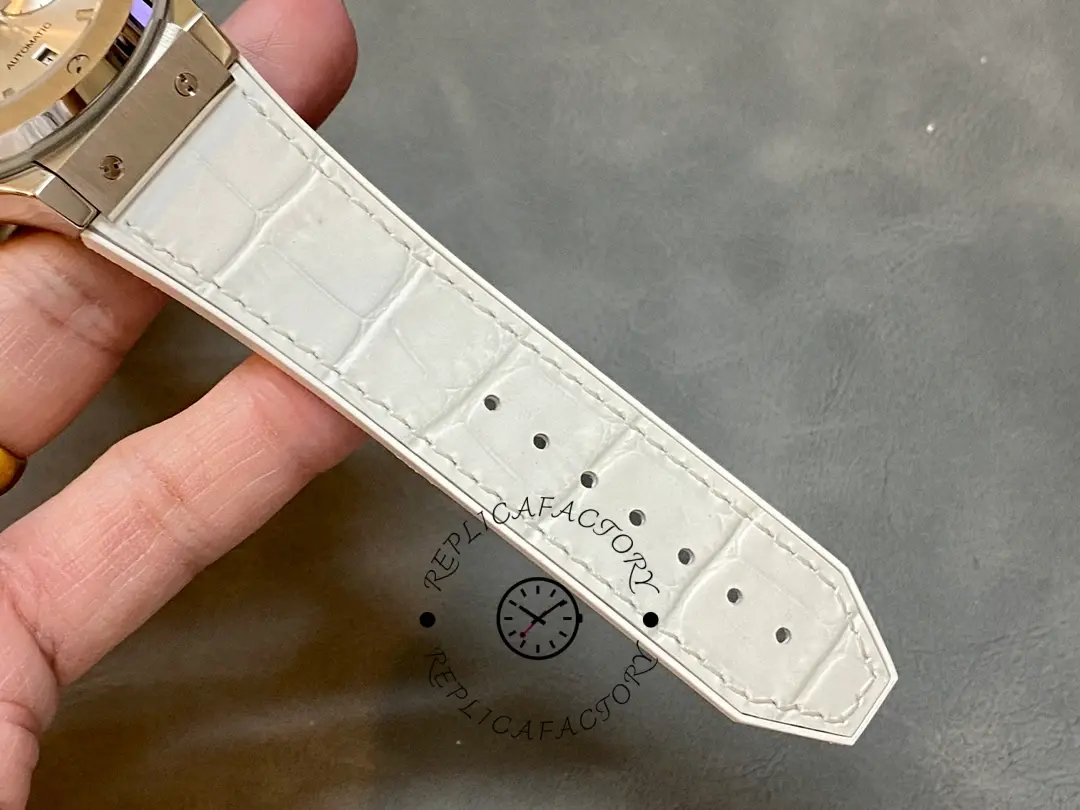 White strap underside of Hublot 521.NX.7071.LR showing holes and strap taper.