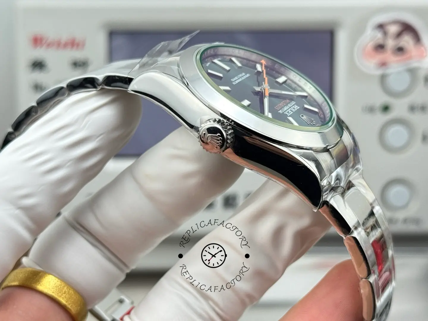 Crown-side view of Rolex Milgauss 116400GV-0002 showing signed crown and polished case side.