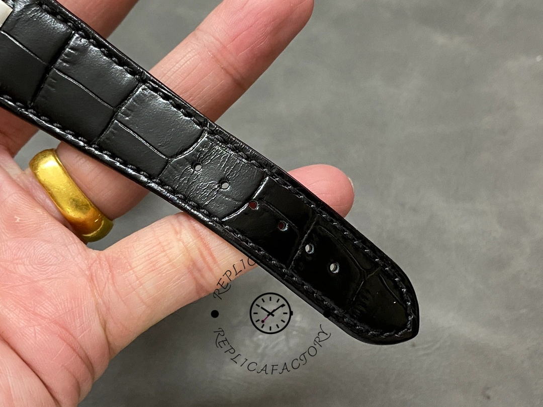 Close-up of the strap on the Patek Philippe Nautilus 5711/1A, showing stitching and texture.