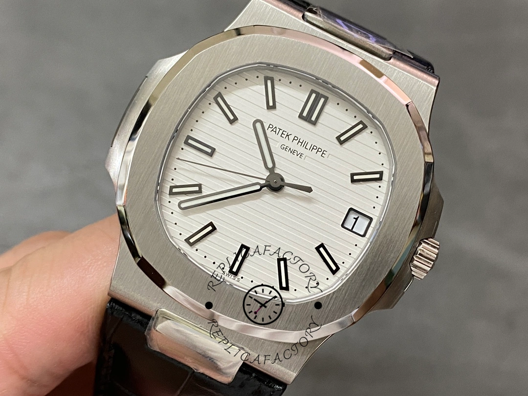 Side-angled shot of the Patek Philippe Nautilus 5711/1A, showing brushed case and bezel edge.