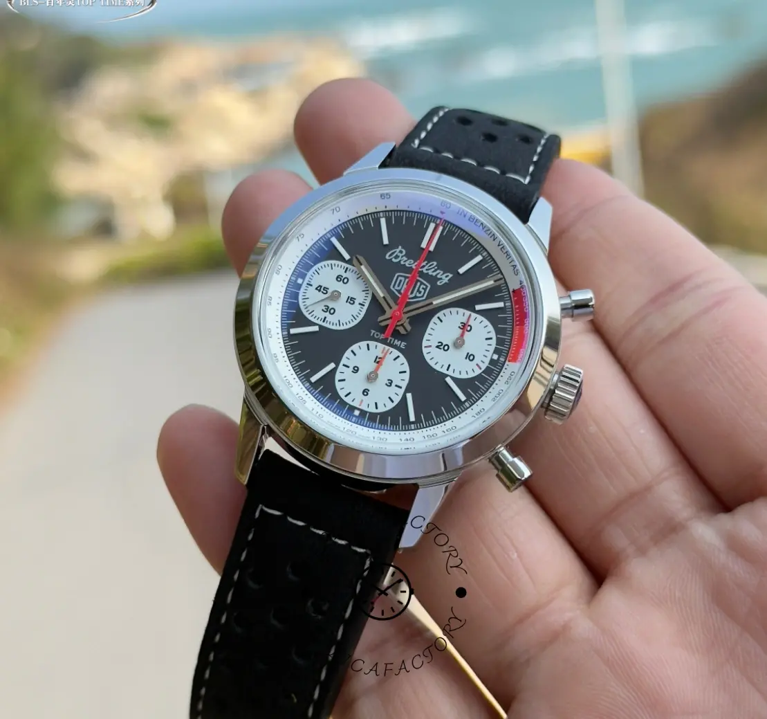 Breitling Top Time B01 Deus Chronograph AB01765A1B1X1, handheld angle showing polished case.