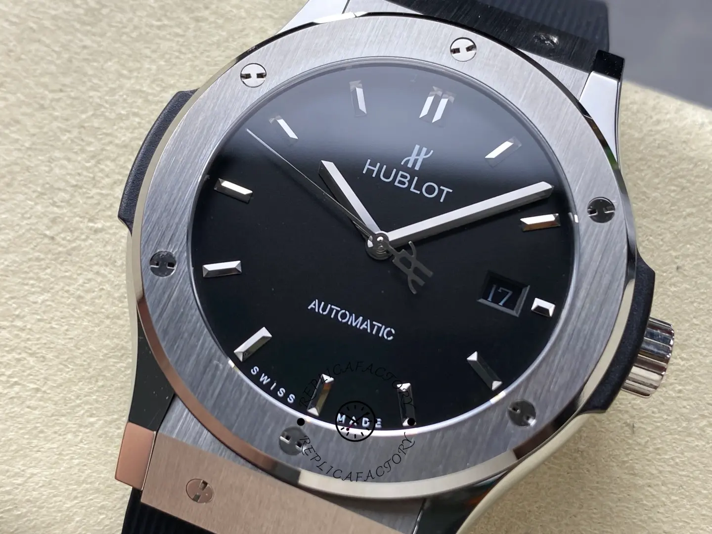 Dial close-up of Hublot 542.NX.1171.RX showing polished hands, HUBLOT logo, and date window detail.