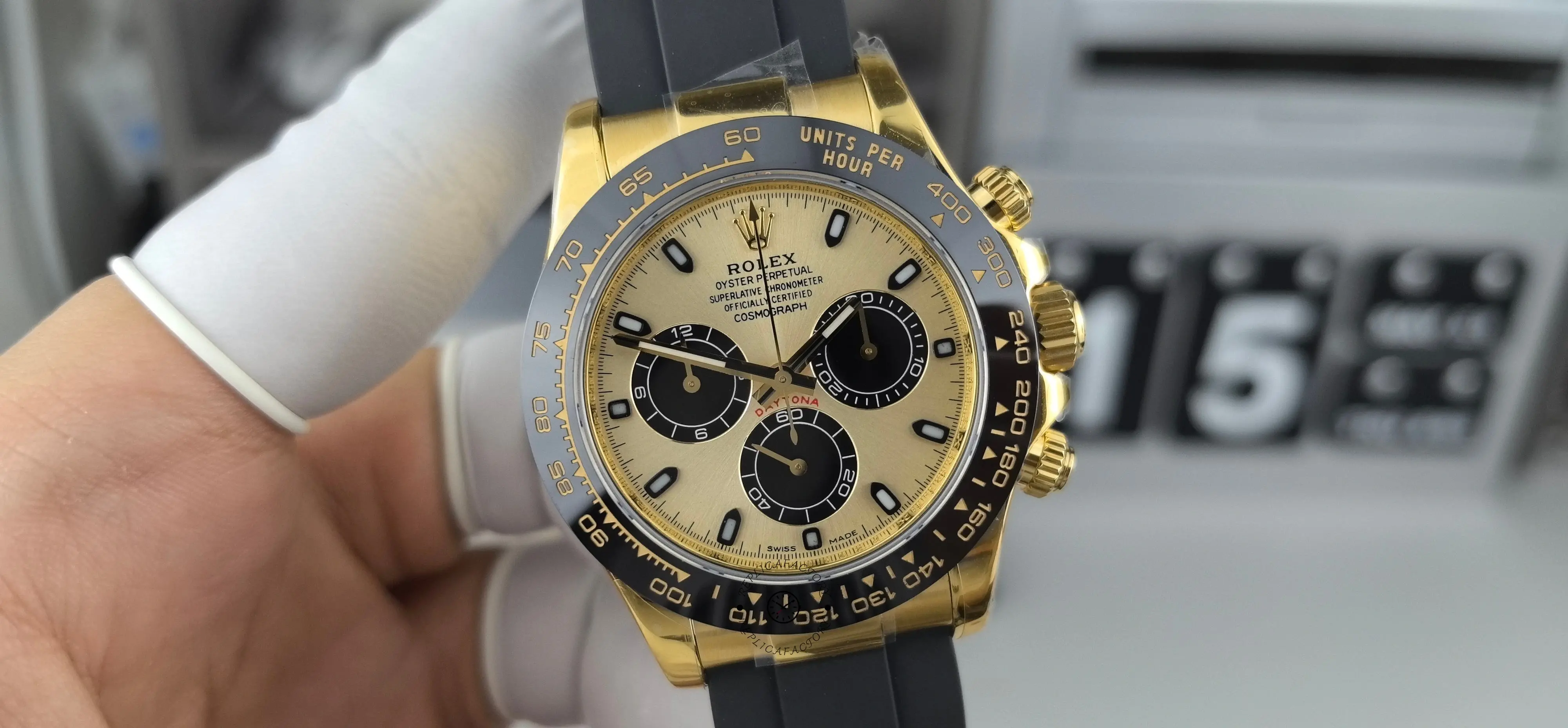 Front view of Rolex Daytona 116518LN with champagne dial, black subdials and black Oysterflex strap.