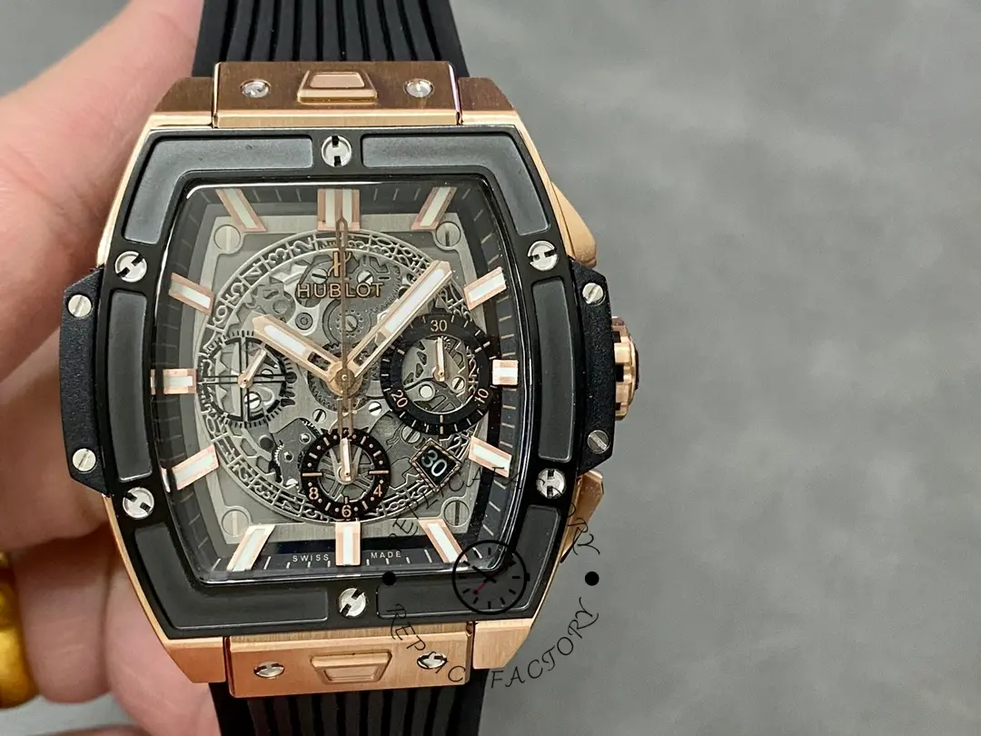 Handheld front view of Hublot 642.OM.0180.RX highlighting skeleton dial and rose gold-tone hands.
