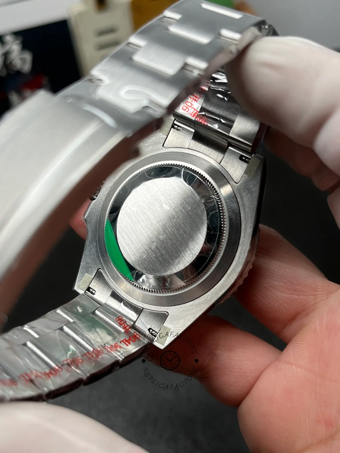 Rear view of Rolex Submariner 126610LN 0001 with solid case back and bracelet end links.