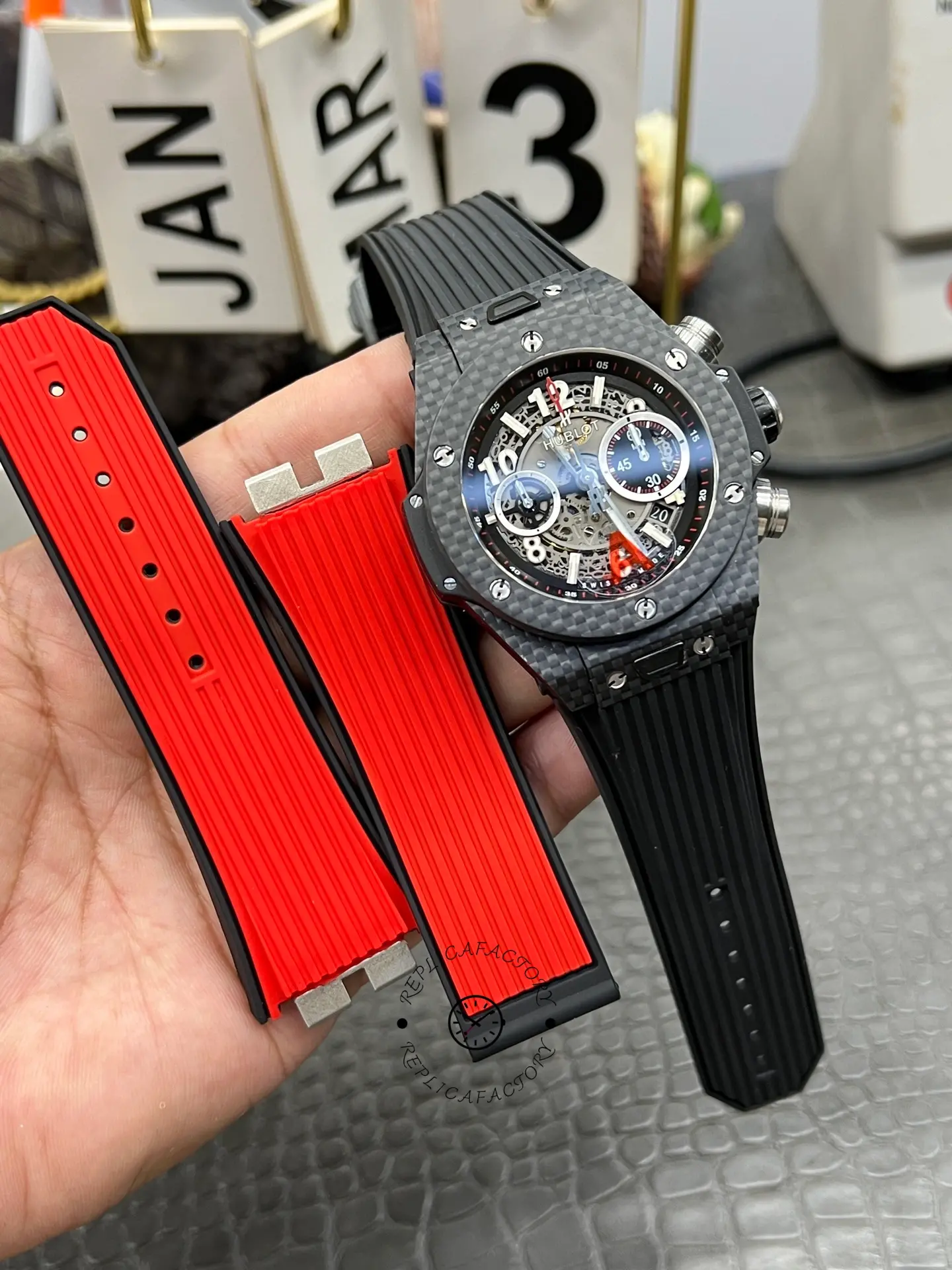 Hublot Big Bang UNICO 411.QX.1170.RX strap set view, extra red straps shown for contrast.