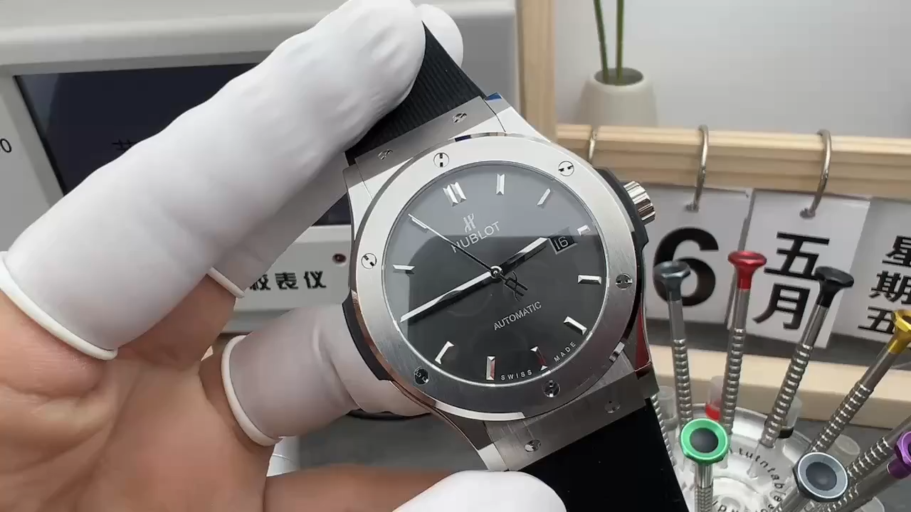 Handheld view of Hublot Classic Fusion 542.NX.1171.RX, showing black dial and smooth bezel. - Video