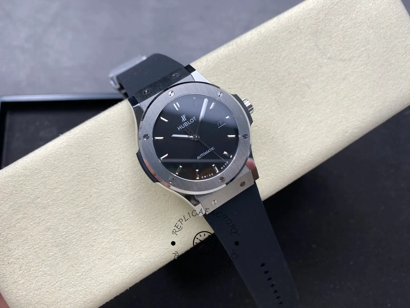 Angled front view of Hublot 542.NX.1171.RX showing brushed bezel, black dial, and rubber strap.