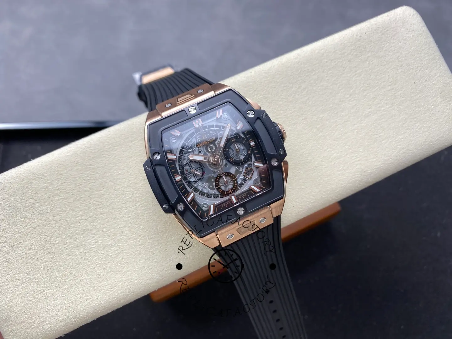 Wrist-rest display of Hublot 642.OM.0180.RX showing full front view on a cushion.