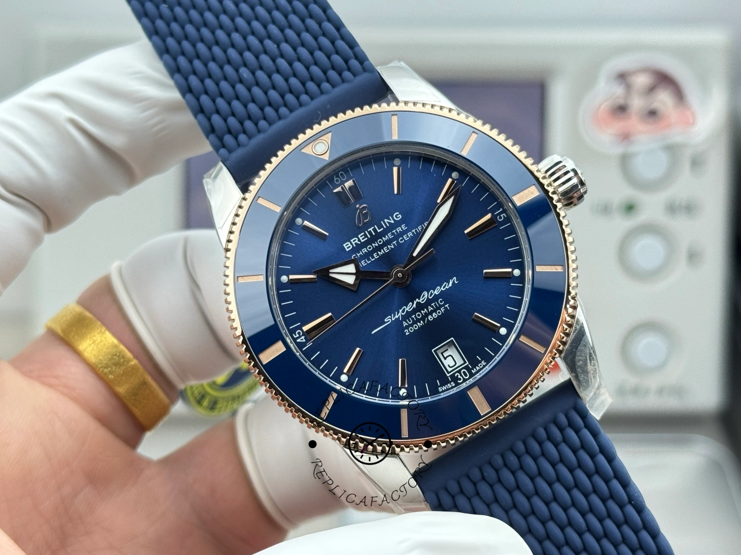 UB3112161C1S1 three-quarter view, showing domed crystal, polished case, and blue rubber strap.