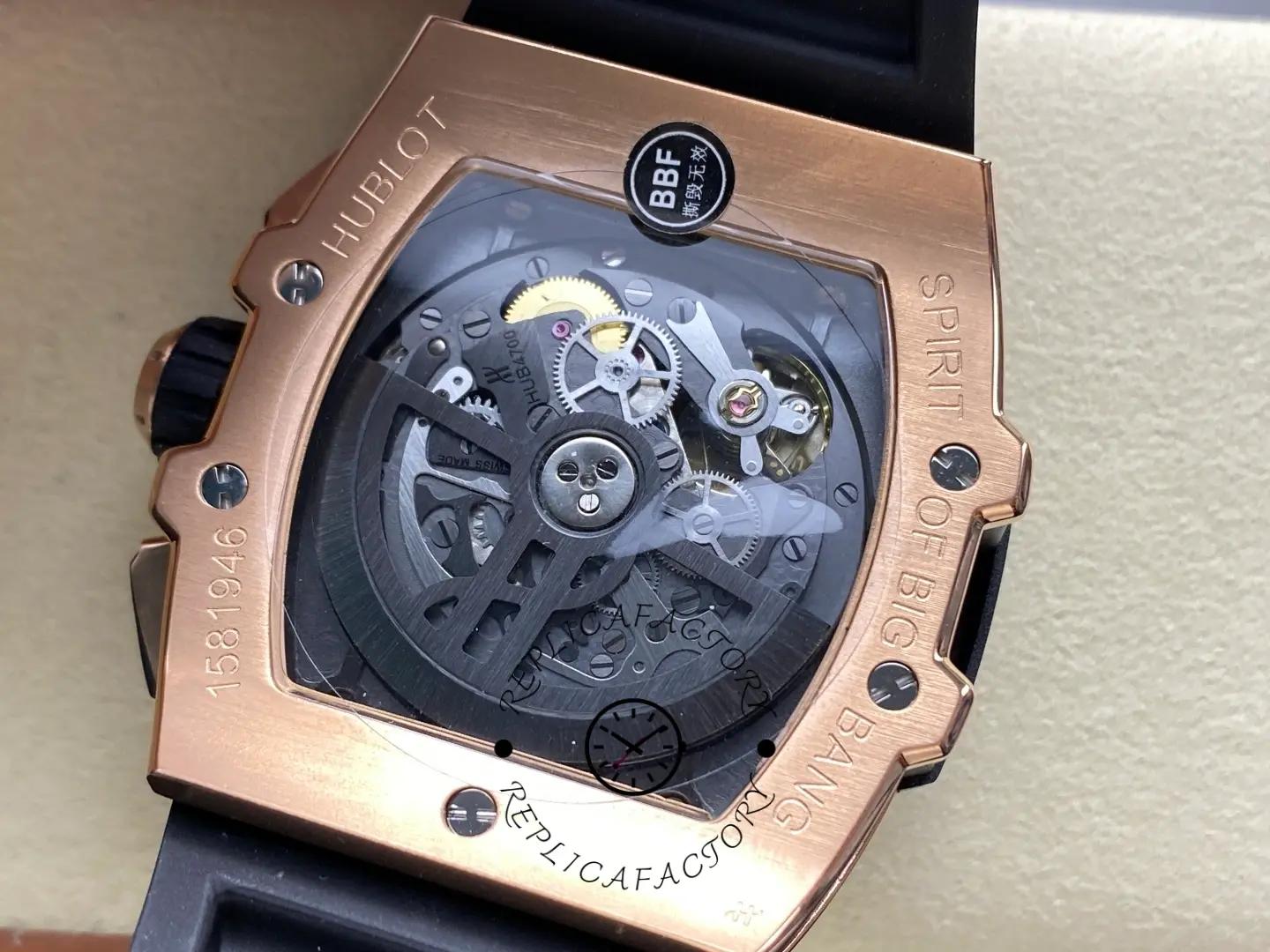 Exhibition caseback of Hublot 642.OM.0180.RX showing rotor and visible gears through sapphire back.