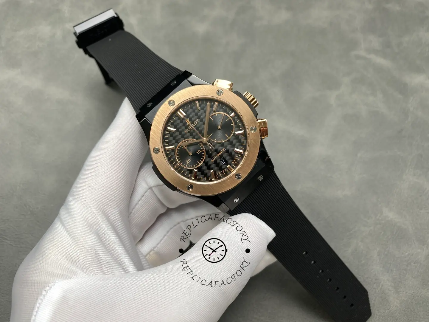 Full watch in glove hand: Hublot Classic Fusion 521.CO.1781.RX showing black strap and case.
