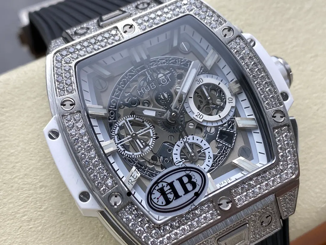 Angled close-up of Hublot 642.NE.2010.RW.1604 highlighting diamond bezel look, skeleton subdials, and white case side.