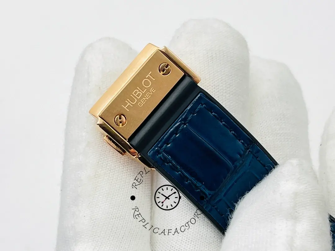 Hublot Classic Fusion 542.OX.1181.LR.1704 strap end on glove, leather texture and clasp end.